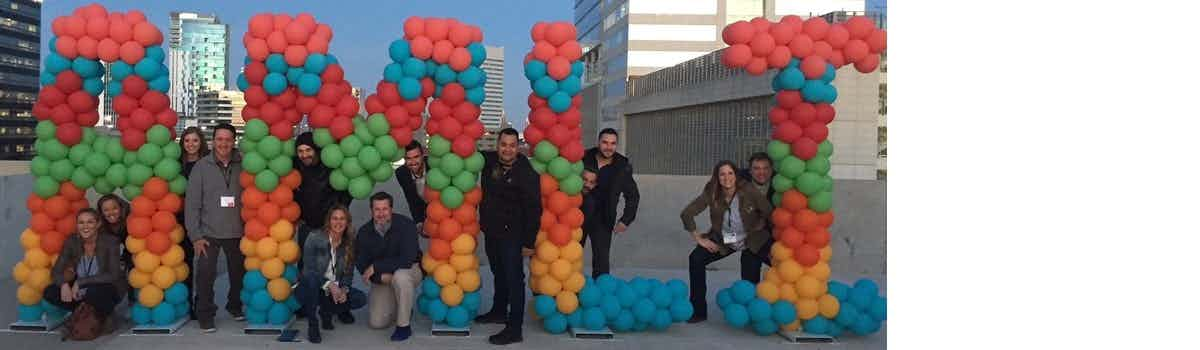 AMLI Team Posing With Balloons