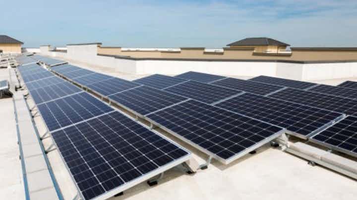 Daytime exterior view of solar panels on an AMLI apartment building roof denoting AMLI’s sustainability focus