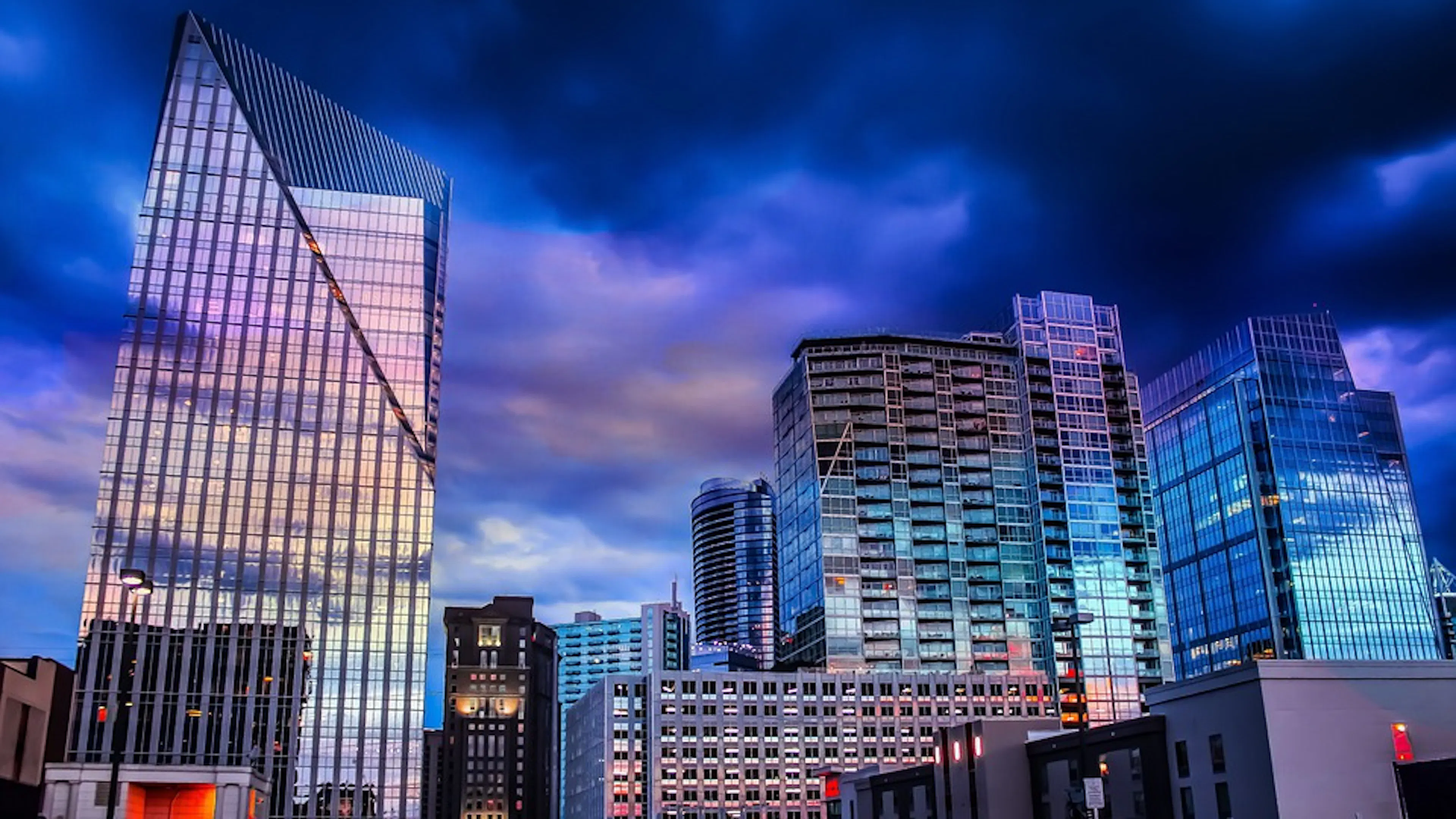 A purple and blue sunset reflecting off the windows of some large Atlanta skyscrapers