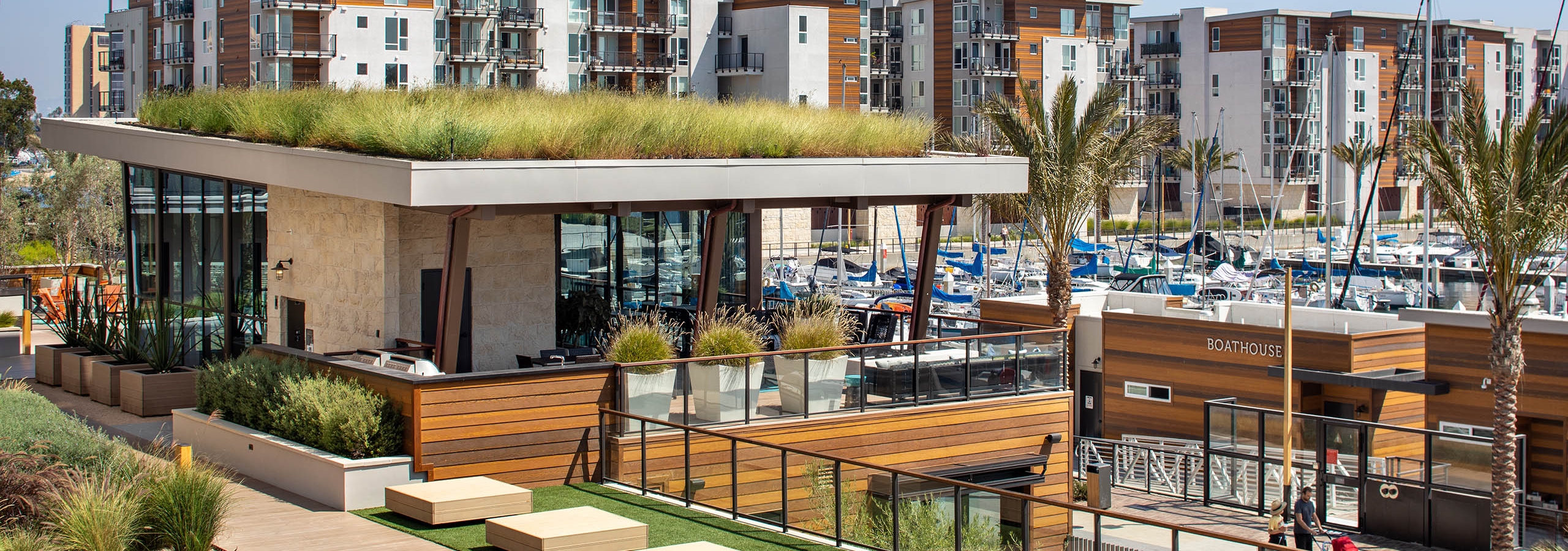 Daytime view of the Jewel building upper deck overlooking the marina and boats at AMLI Marina Del Rey apartments