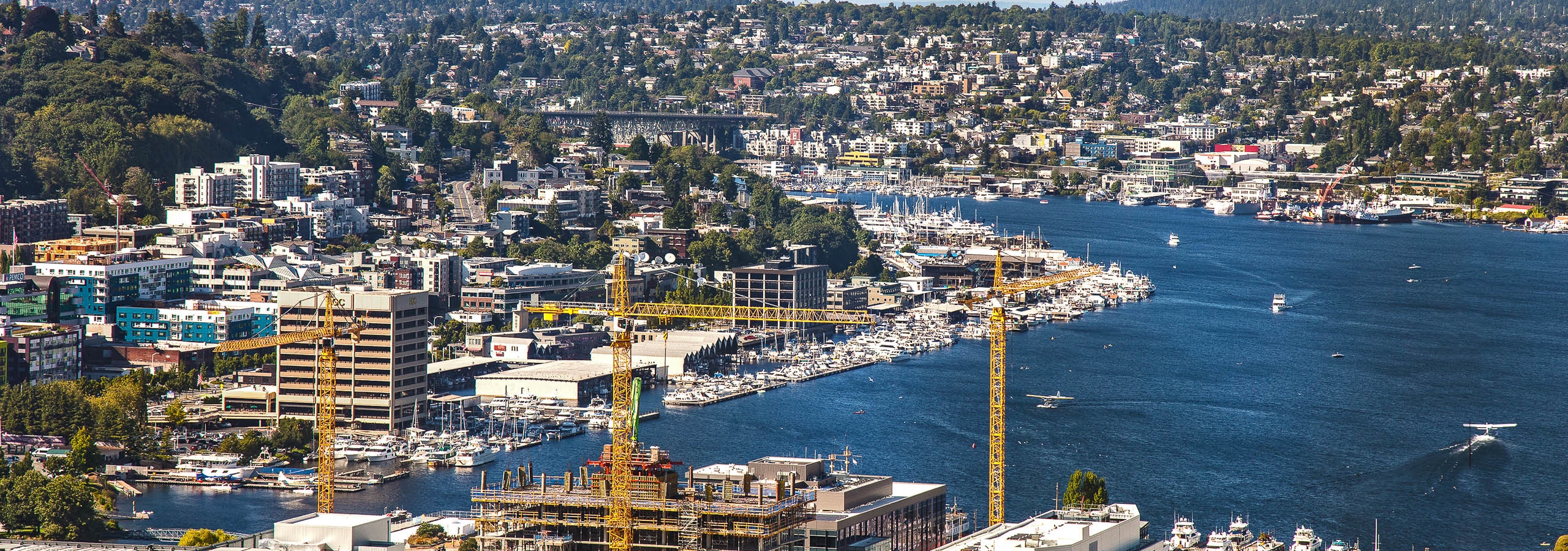Blue Sky sunny Seattle Day Exterior view from AMLI Arc of Lake Union Wallingford and Westlake Ave from the 41st floor