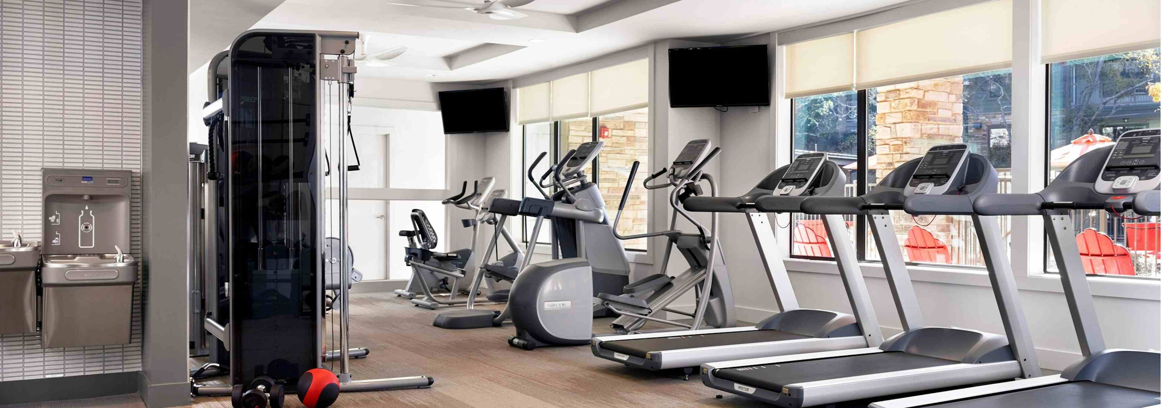 AMLI Covered Bridge 24-hour state-of-the-art fitness zone with treadmills, elliptical machines, water station and weight machines