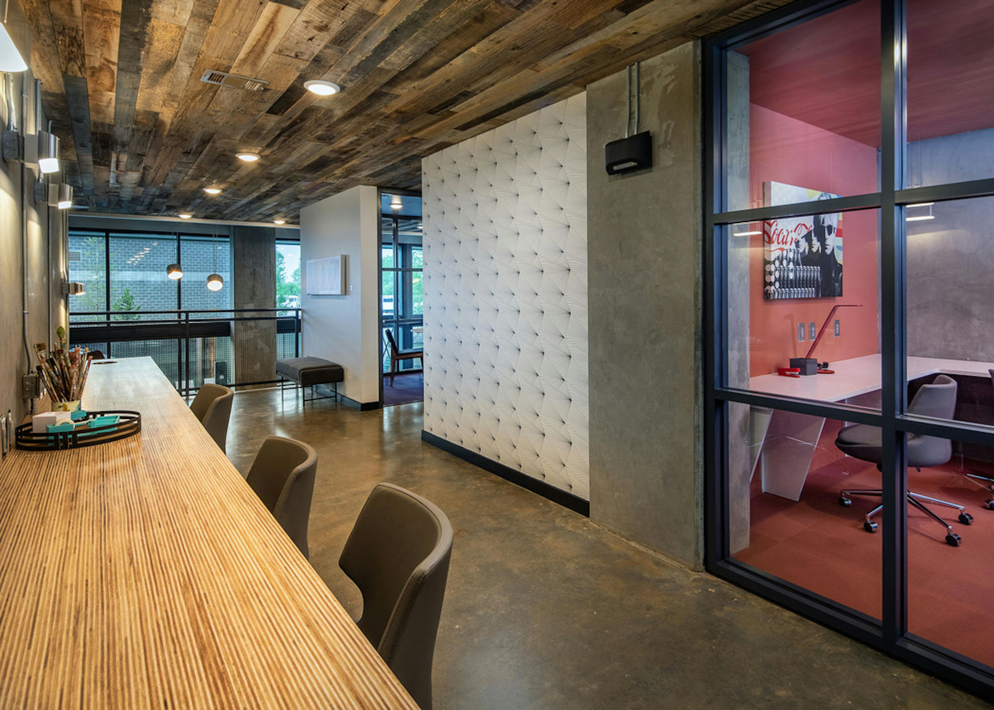 AMLI Westside apartment modern community work spaces with concrete flooring and private work offices with glass doors