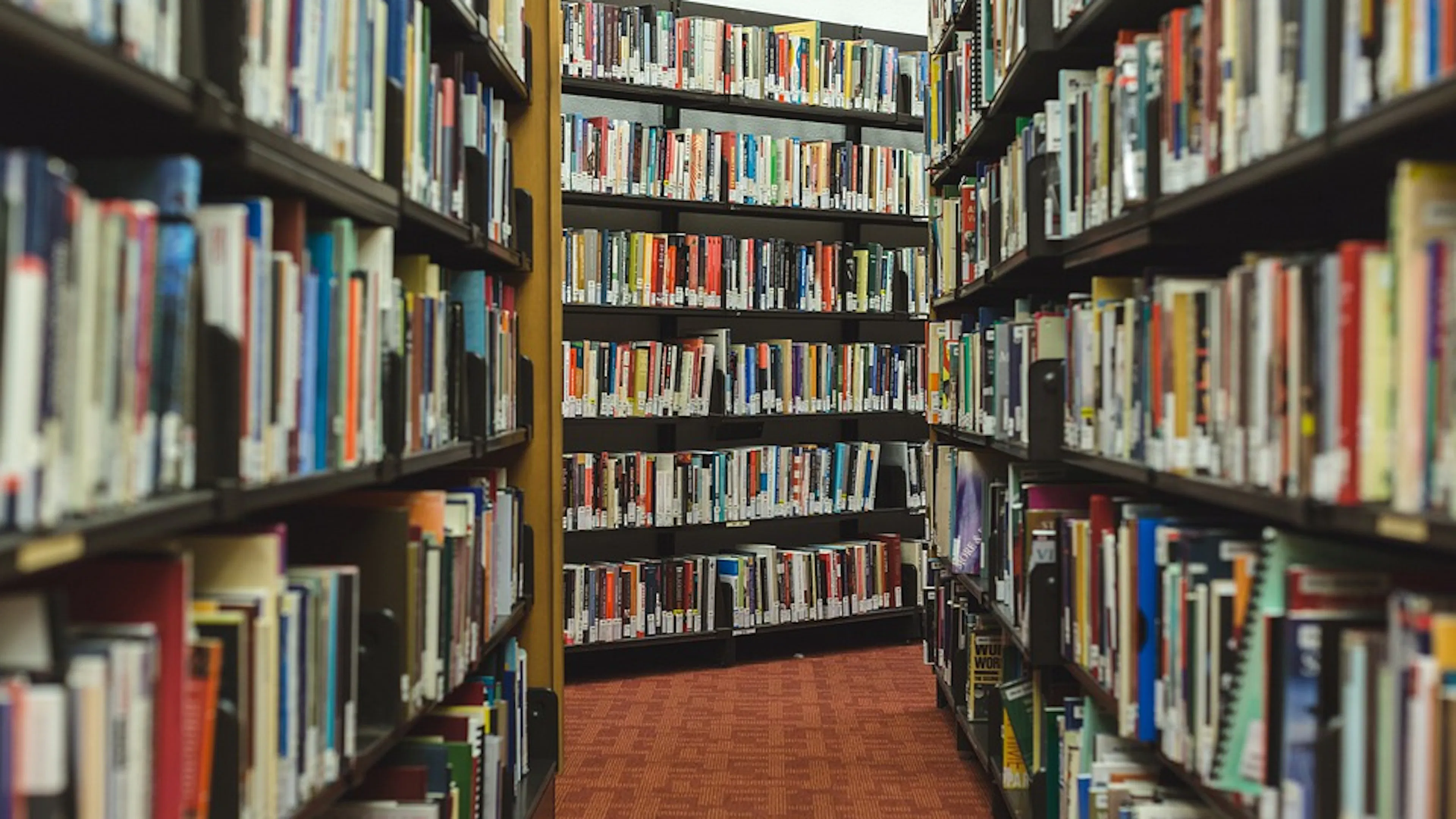 The inside of a library with a close up on shelves of books