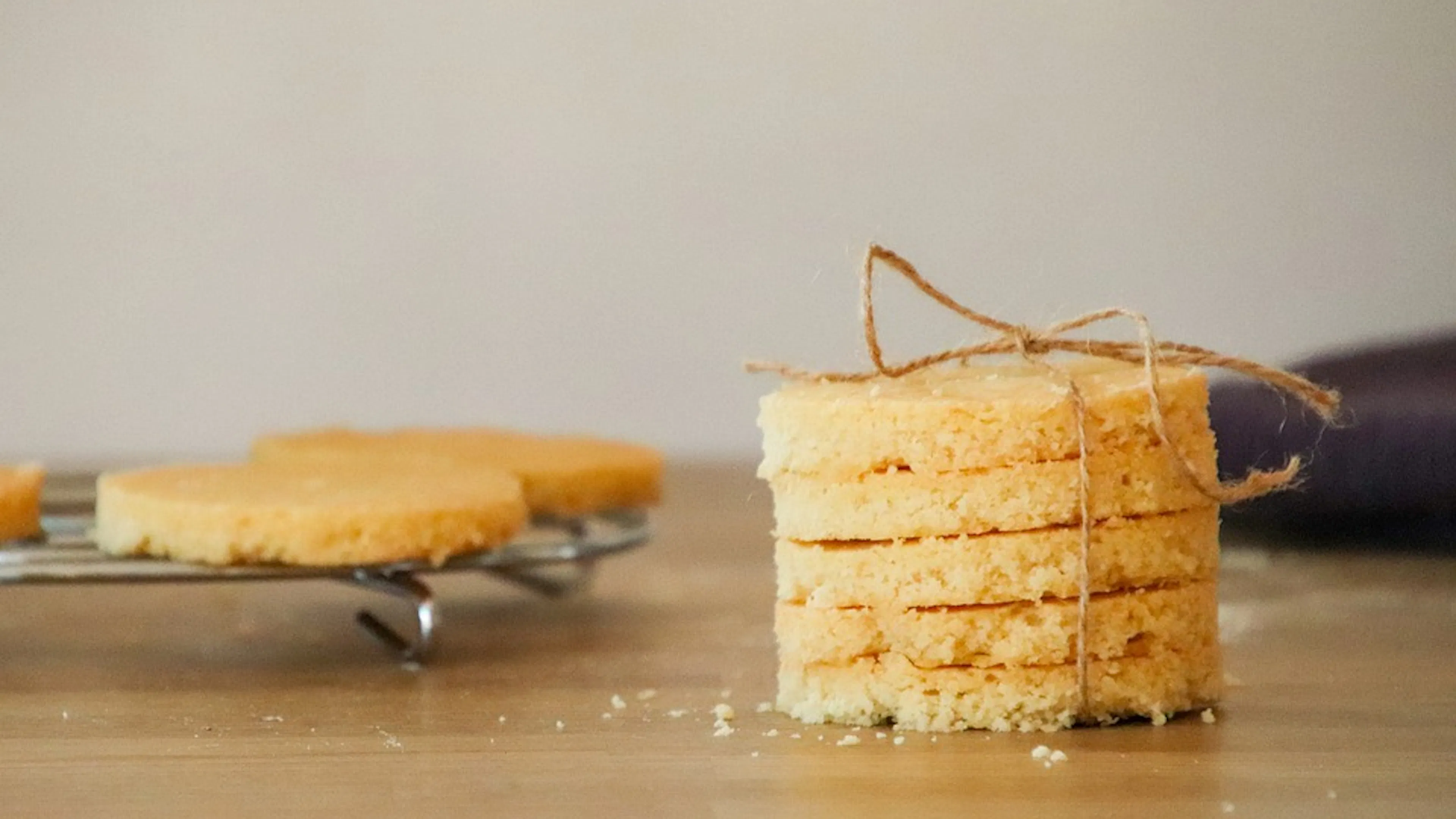 A stack of five round shortbread cookies tied together with brown twine