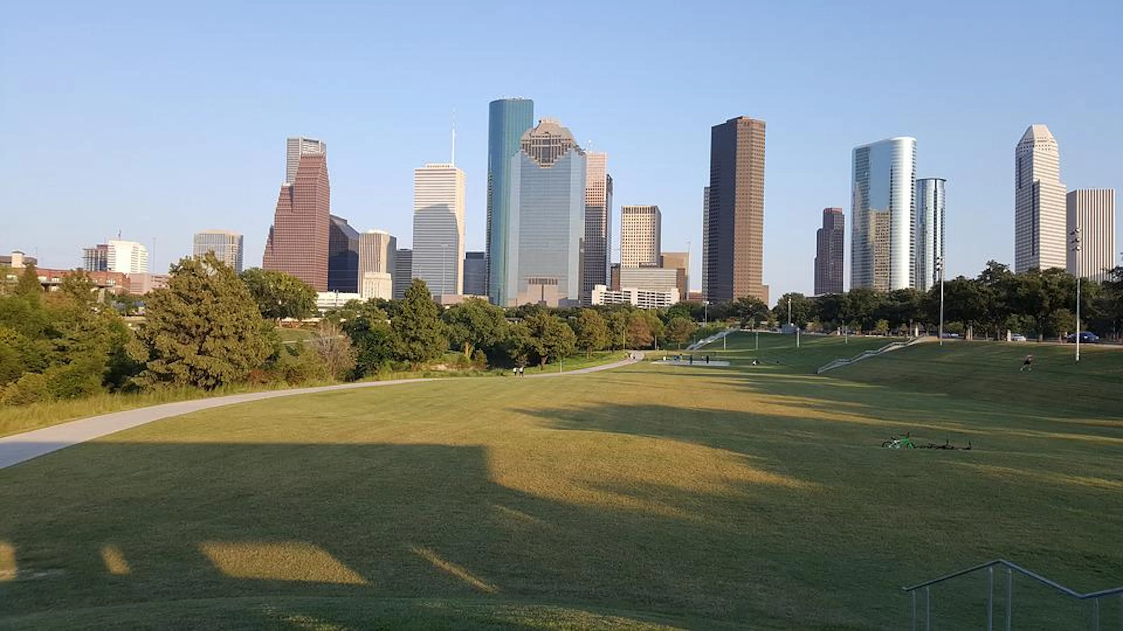 A Houston park in front of the downtown skyscrapers on a sunny clear day