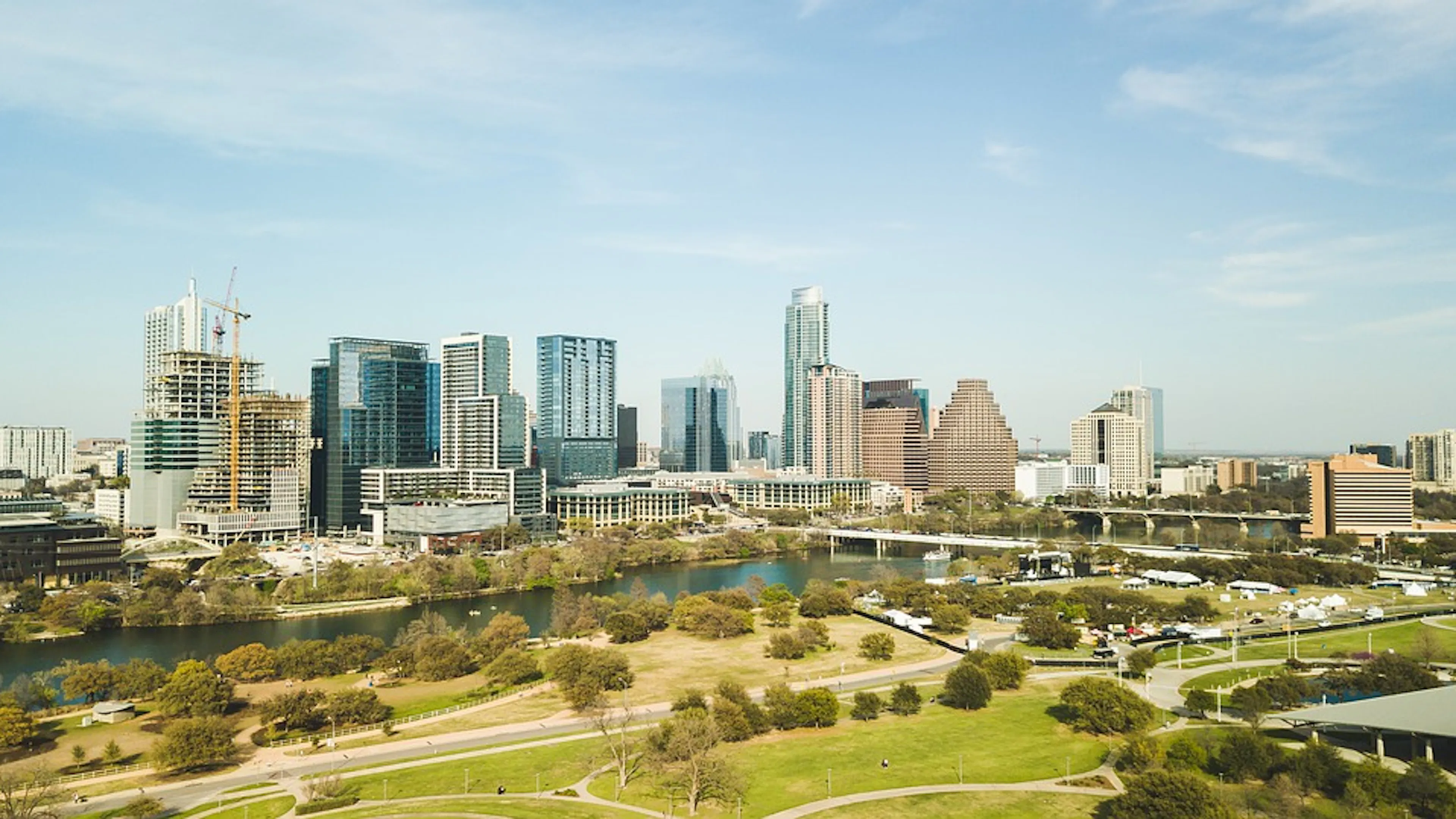 The city of Austin from across the river and against a  clear blue sky