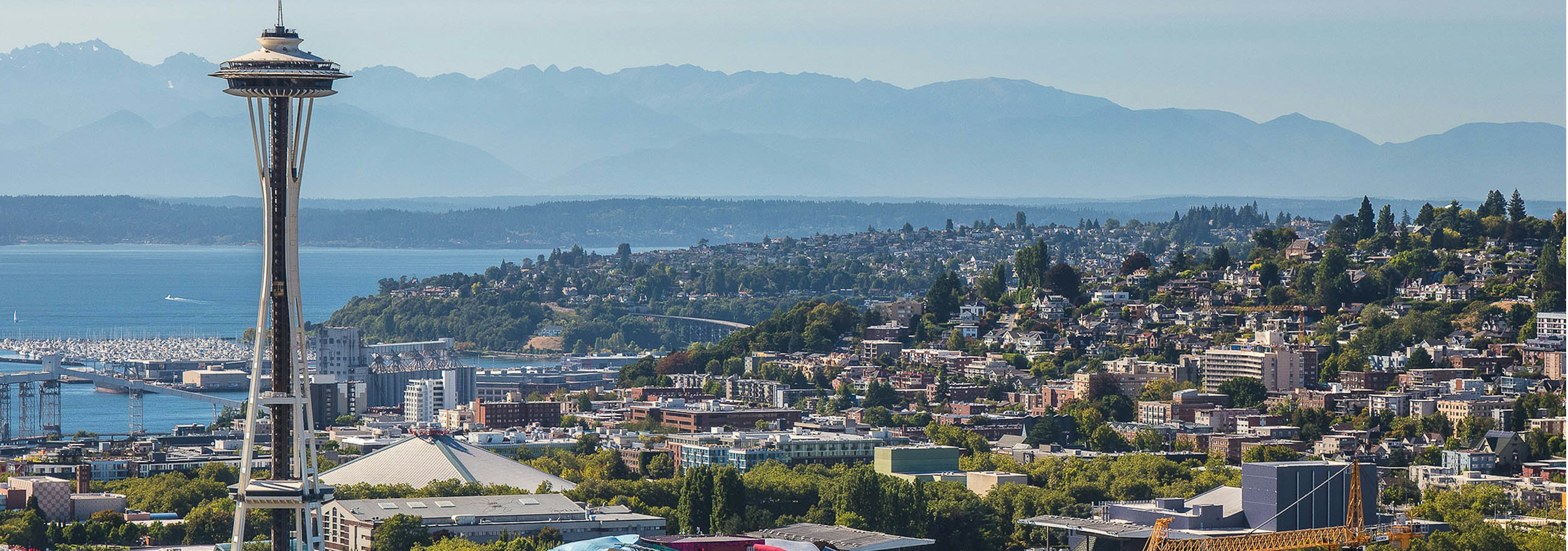 Beautiful Sunny Seattle day exterior view from AMLI Arc of the Seattle Space Needle and the Puget Sound and Queen Ann 