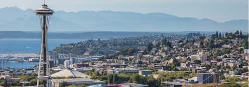 Beautiful Sunny Seattle day exterior view from AMLI Arc of the Seattle Space Needle and the Puget Sound and Queen Ann