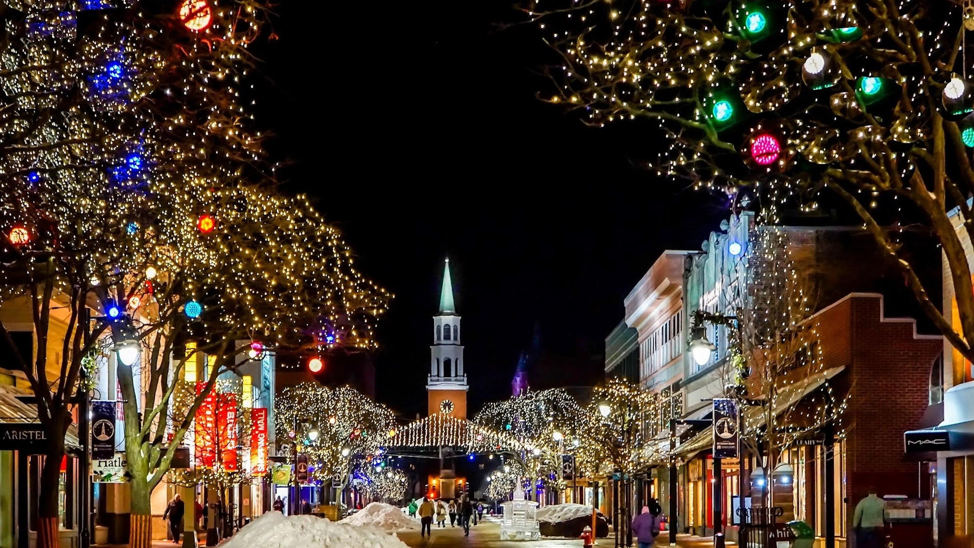 Town street with Christmas lights and snow