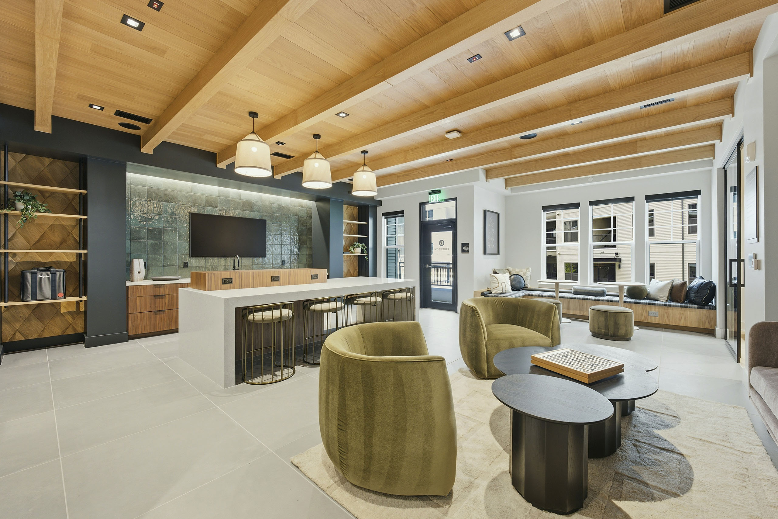 Brightly lit clubhouse with kitchen at AMLI Brookhaven.