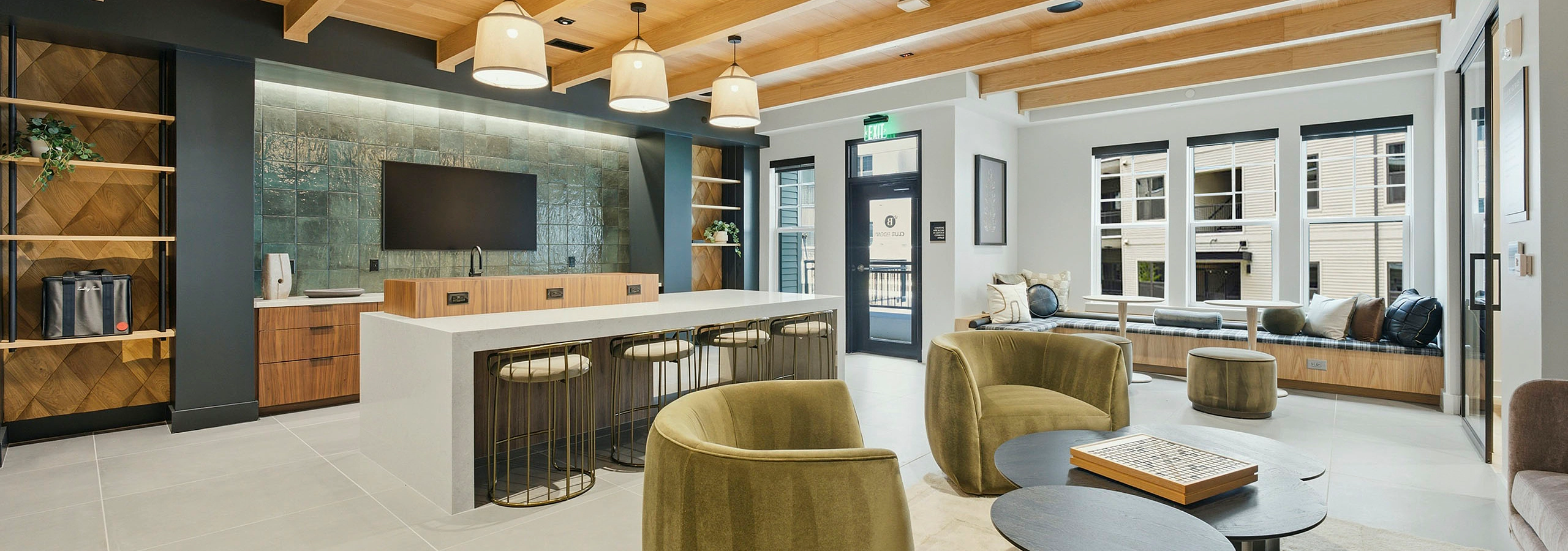 Brightly lit clubhouse with kitchen at AMLI Brookhaven.