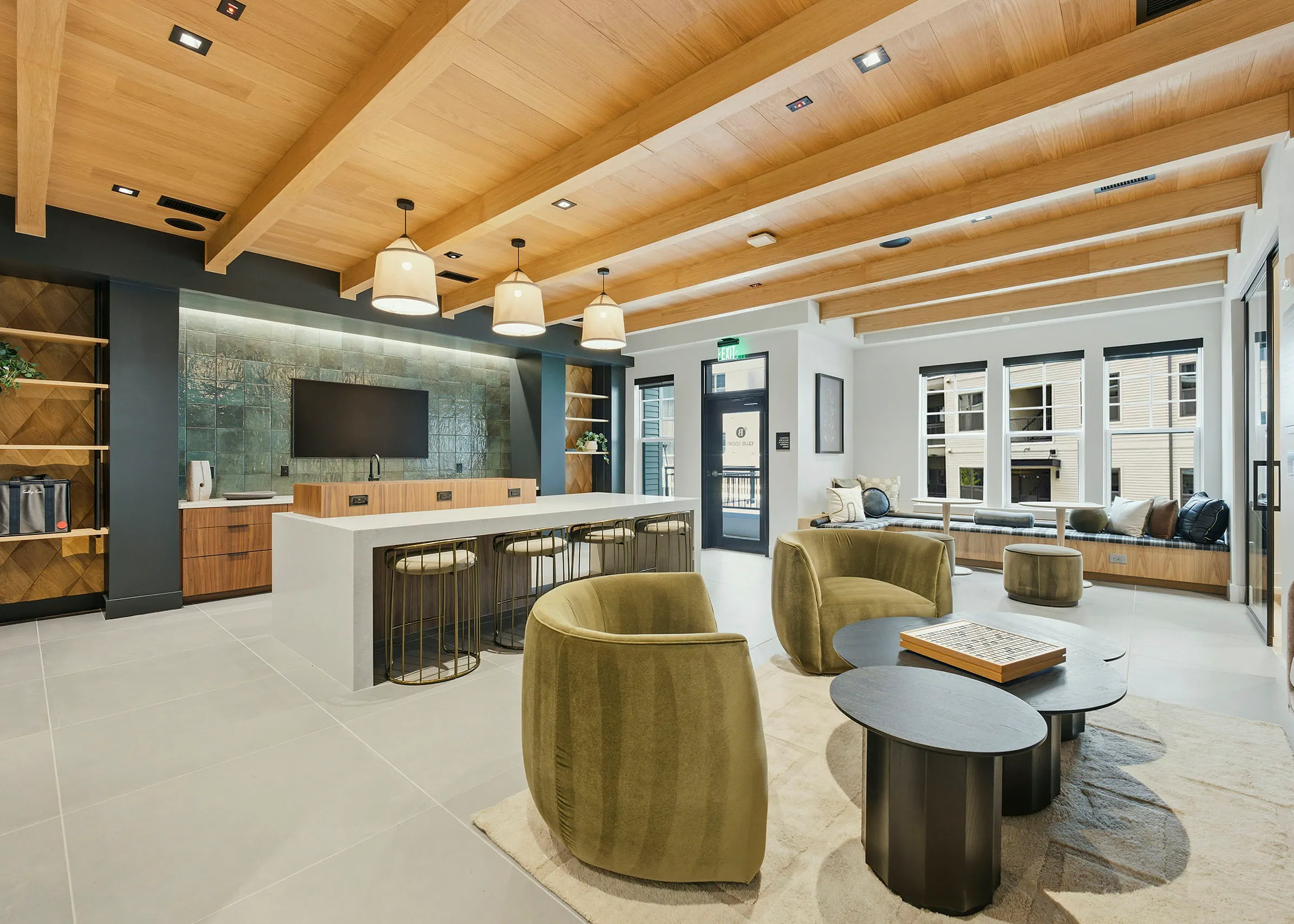 Brightly lit clubhouse with kitchen at AMLI Brookhaven.