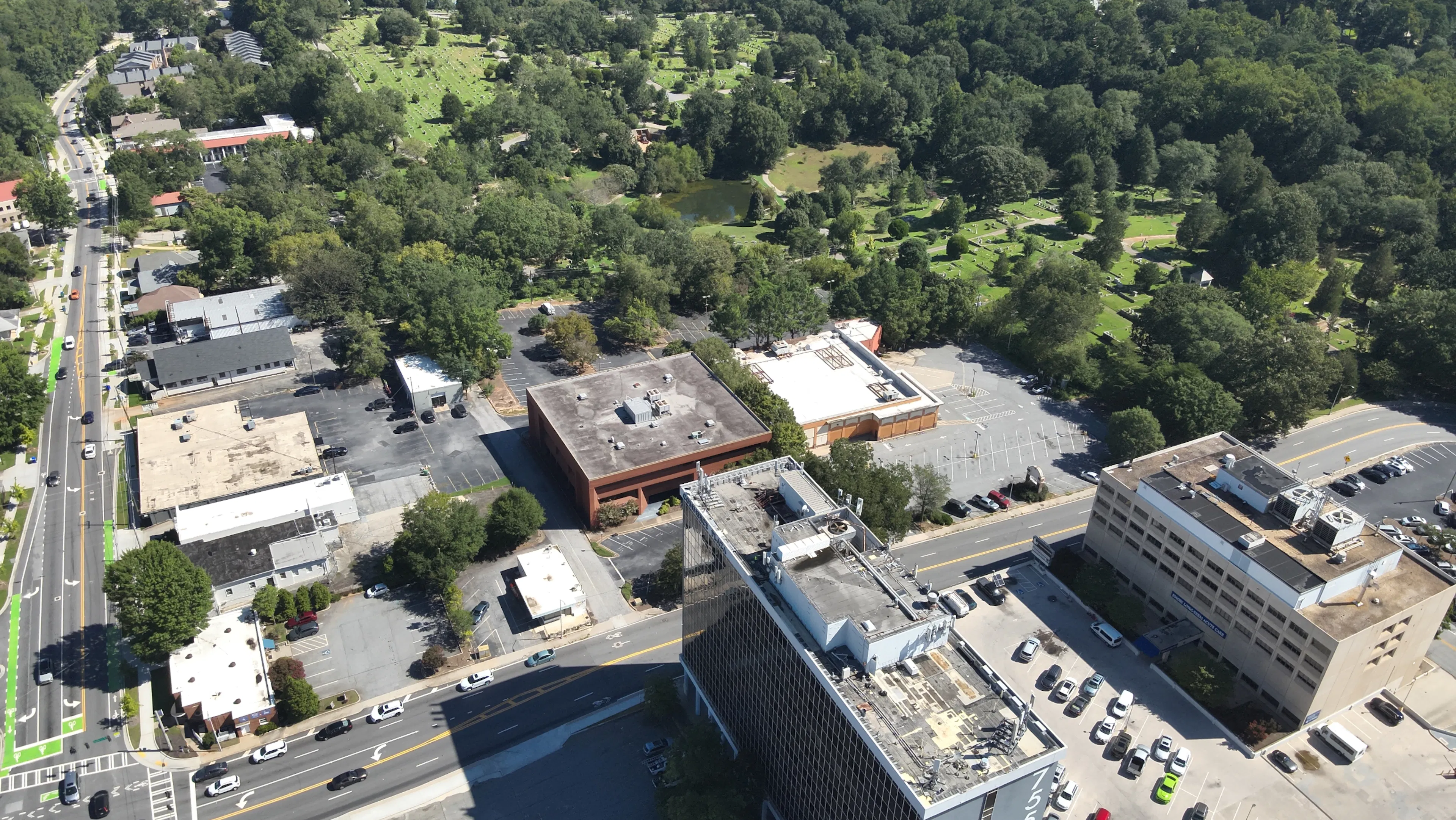 Aerial shot of AMLI Market Square land in a vibrant, tree-lined urban neighborhood.