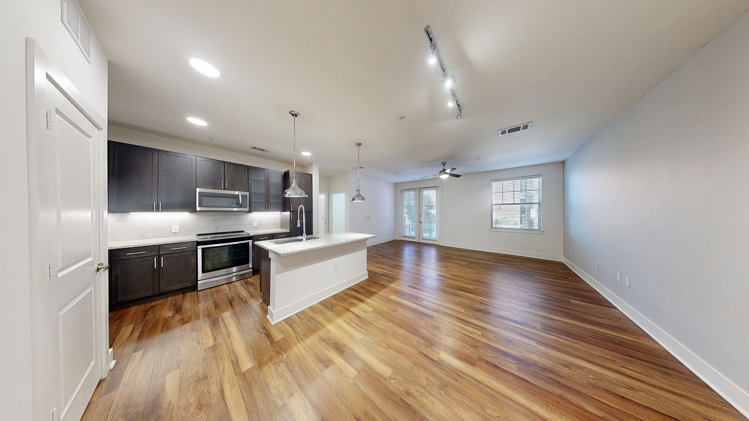 AMLI Grapevine kitchen and living with hardwood flooring