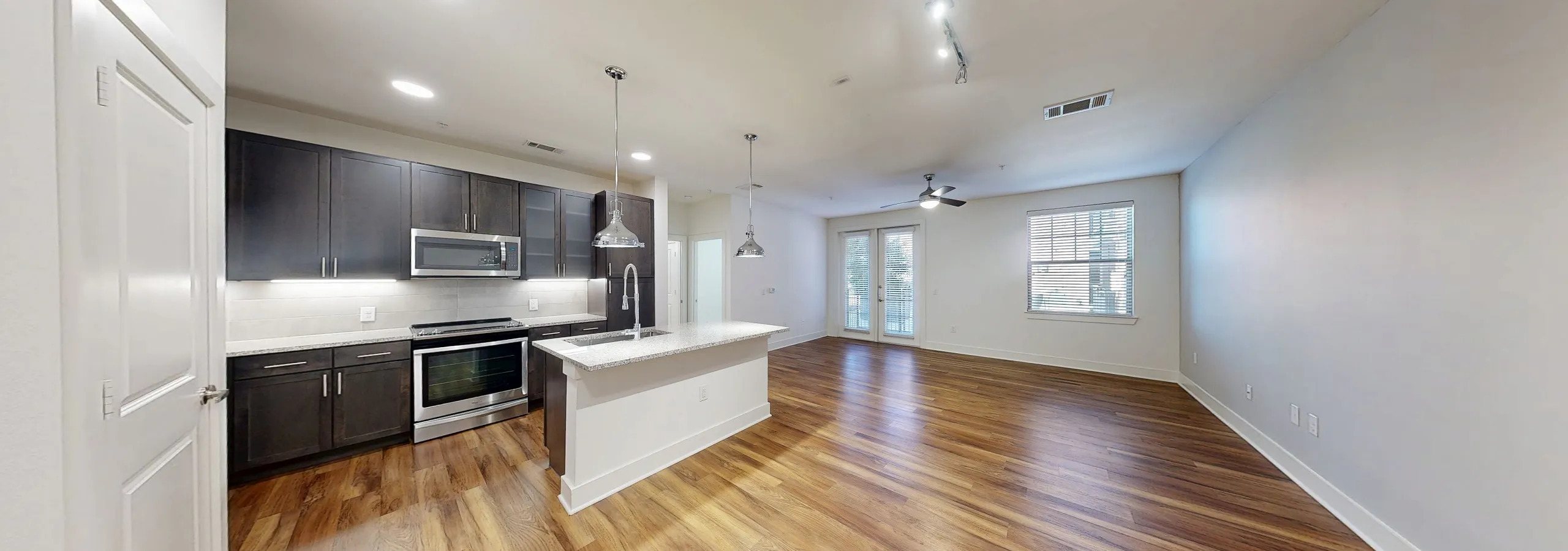 AMLI Grapevine kitchen and living with hardwood flooring