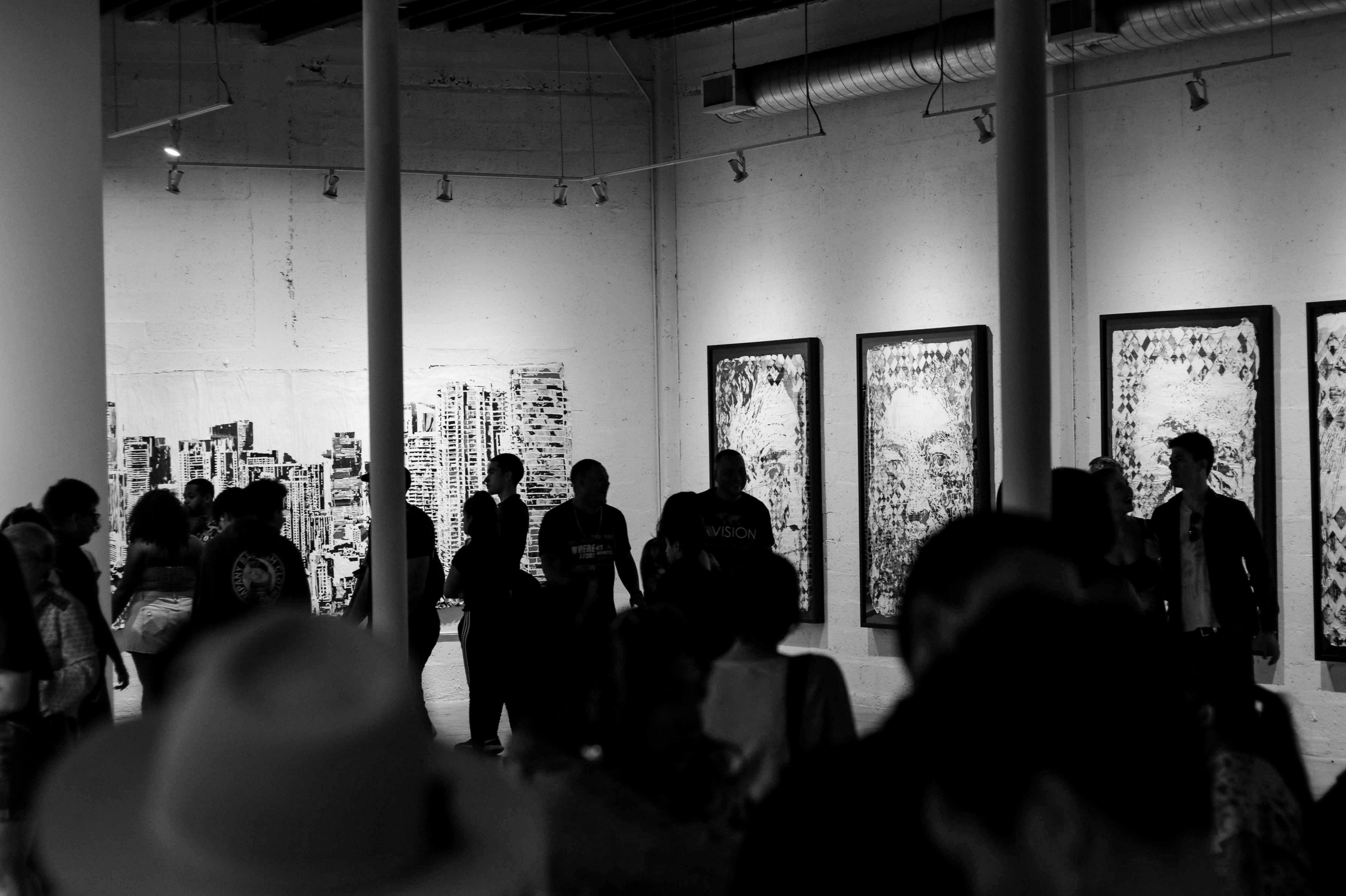 A busy graffiti art gallery photographed in black and white