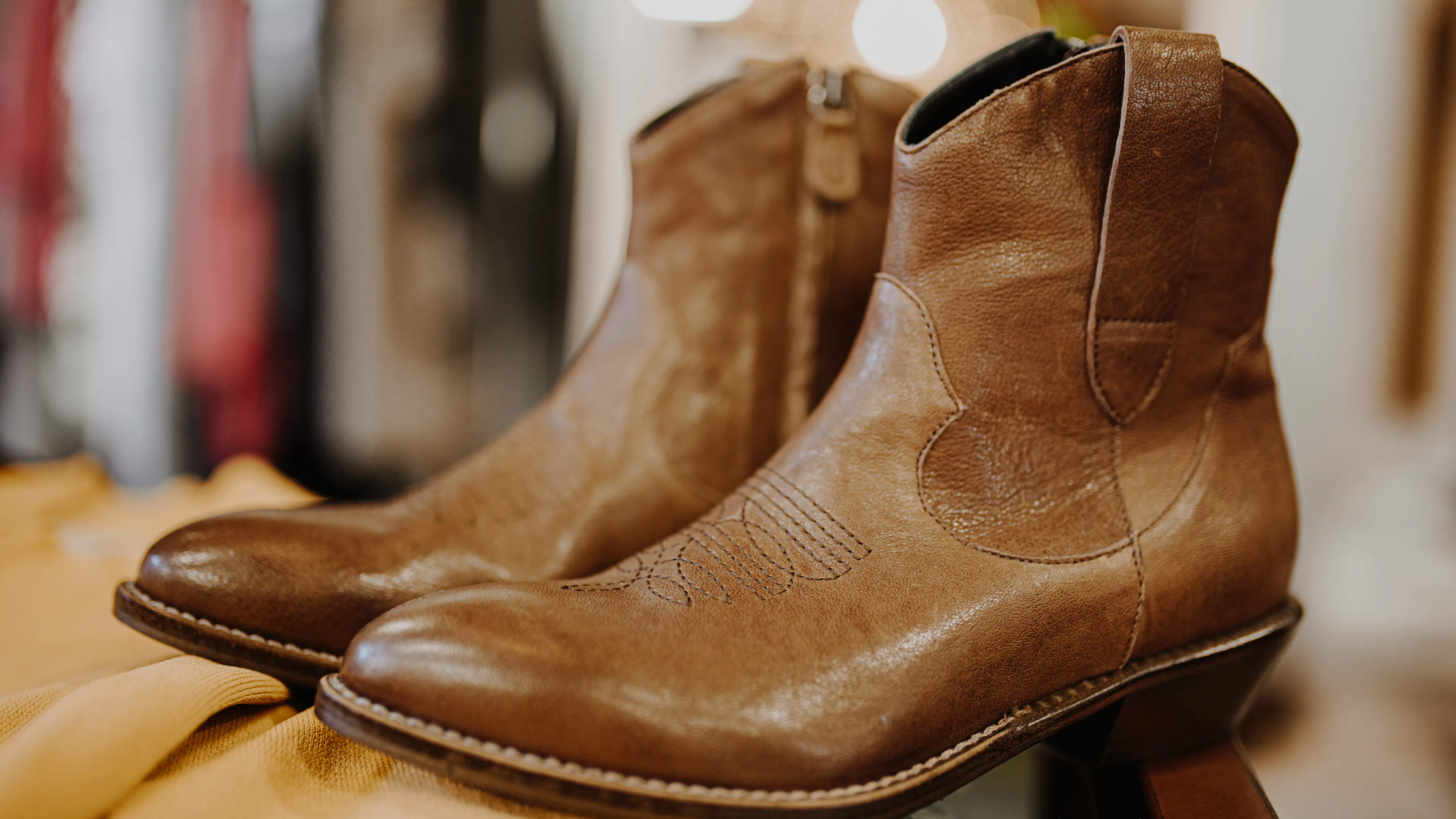 A pair of brown leather boots on display in a store