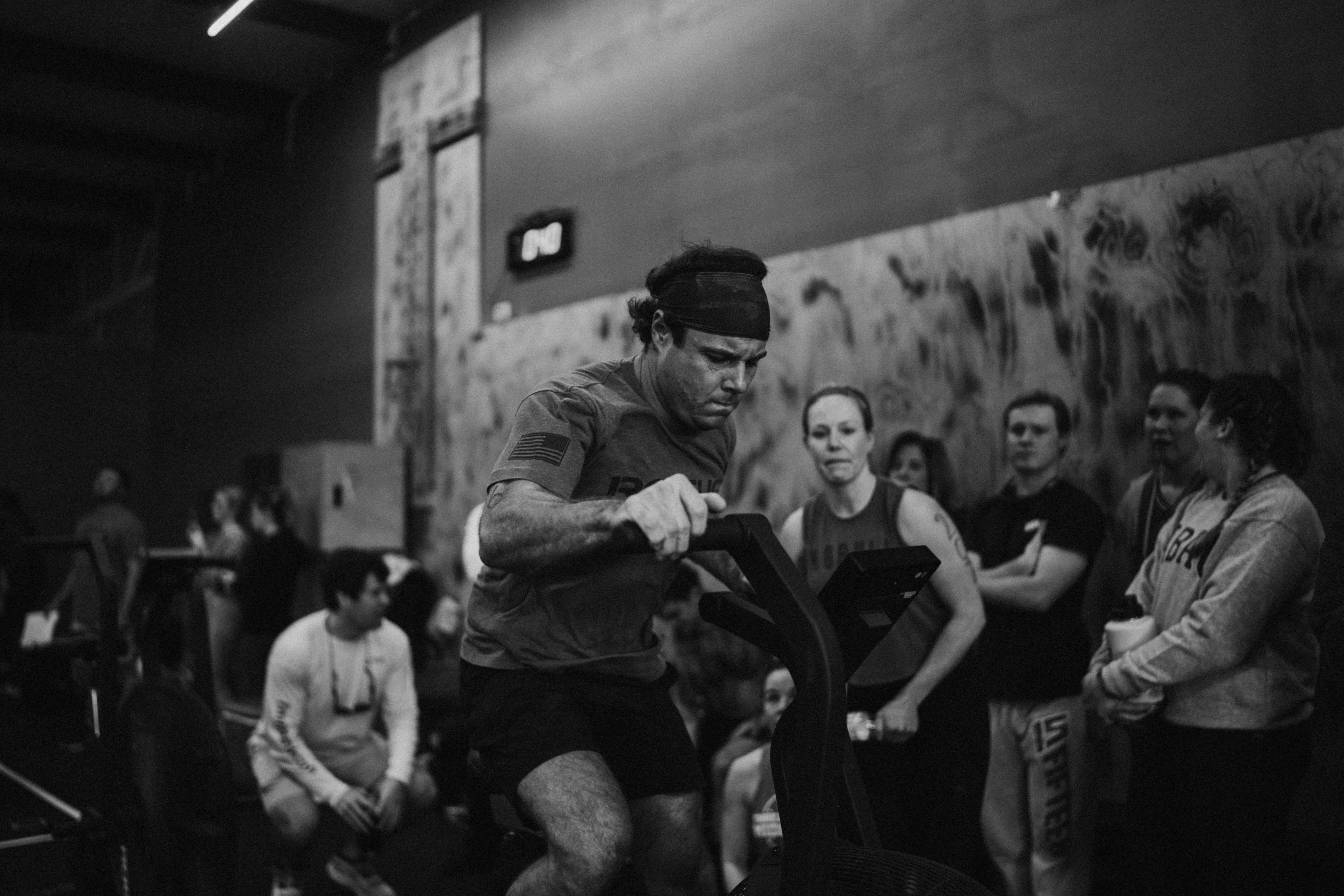 A person in a crossfit class on an assault bike
