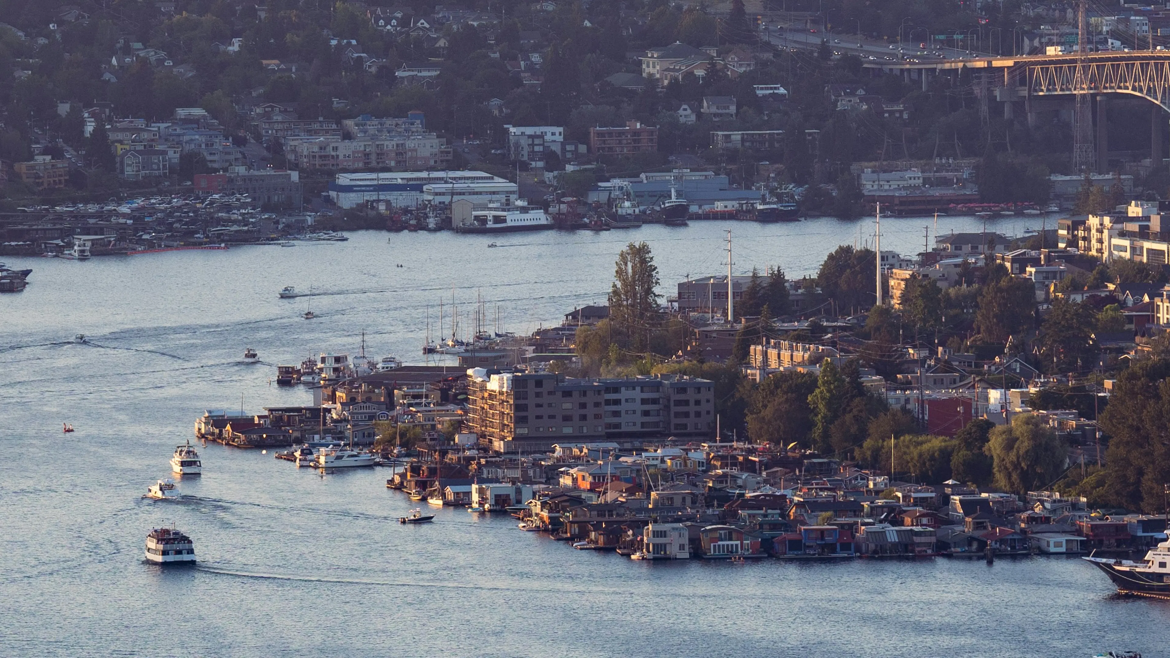 An aerial view of lake union from the south, focusing on the collection of houseboats in the center