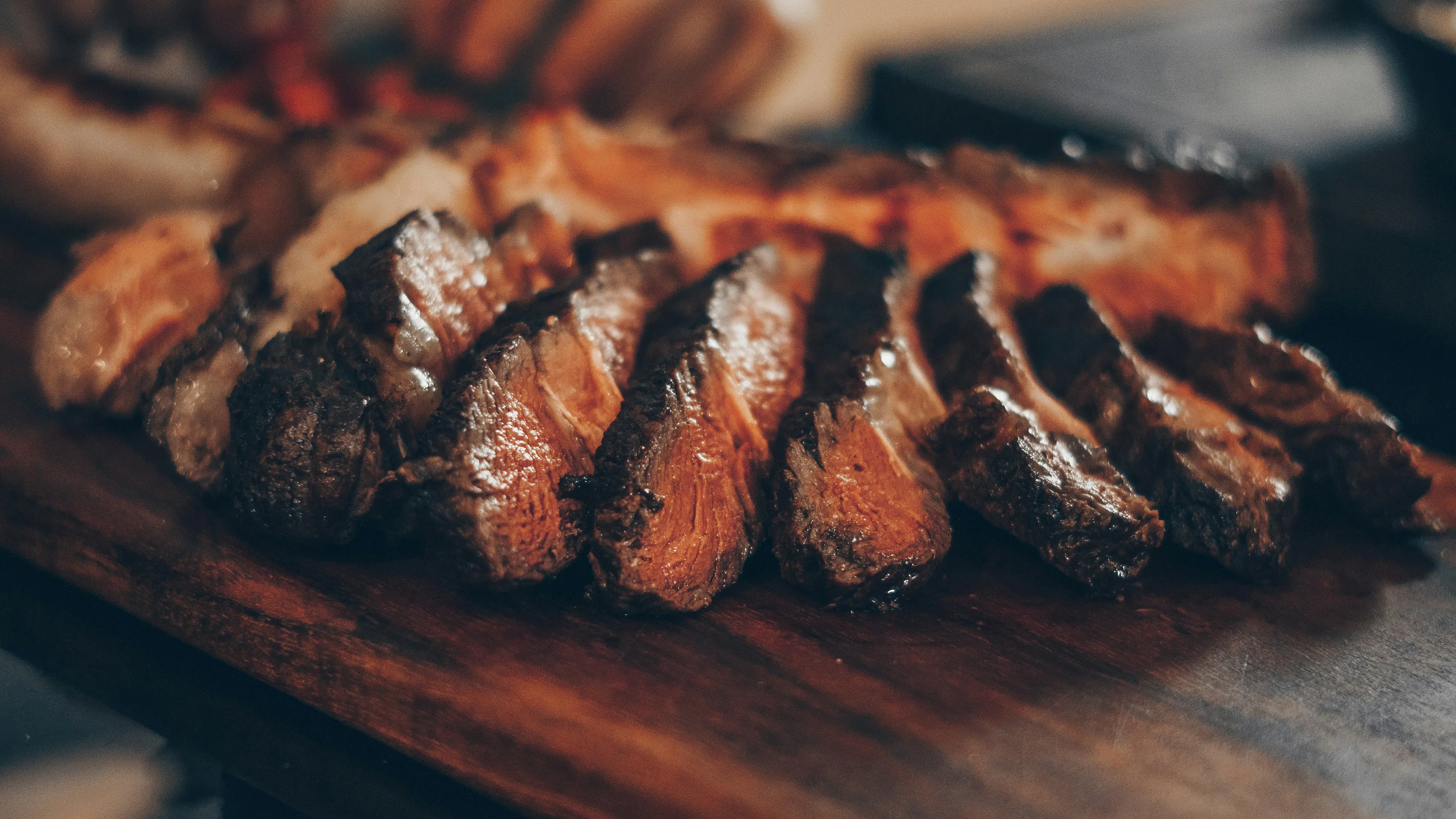A big piece of brisket sliced into juicy pieces