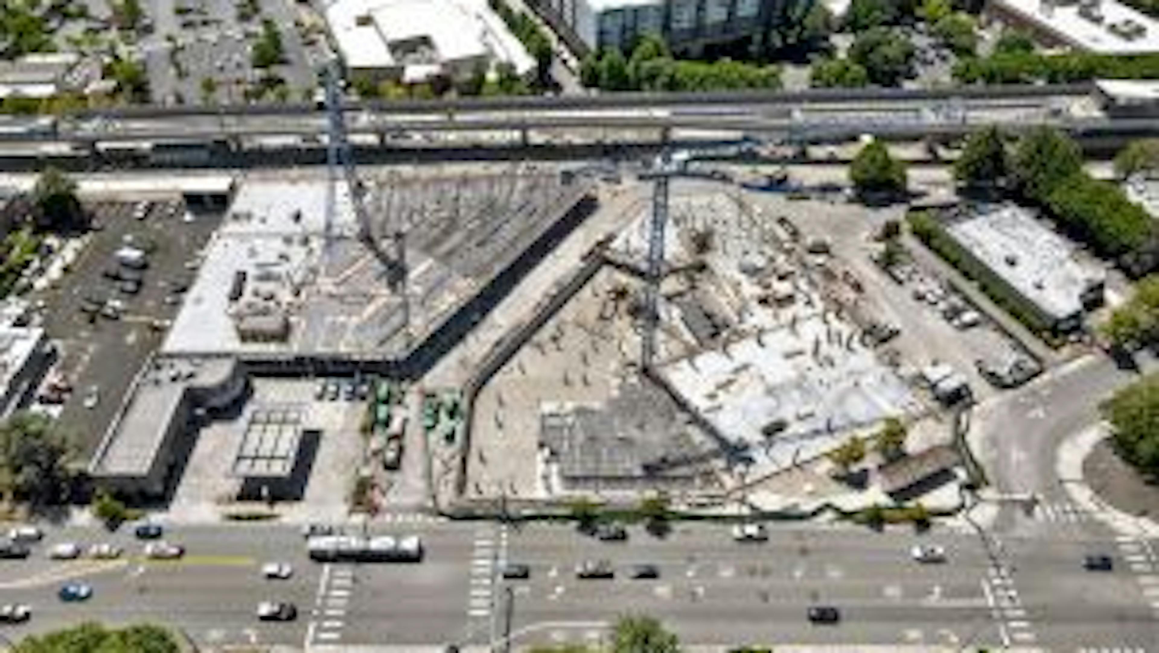 Aerial view of AMLI Redmond Way construction site with concrete garage and podium underway