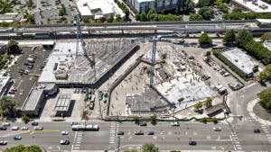Aerial view of AMLI Redmond Way construction site with concrete garage and podium underway