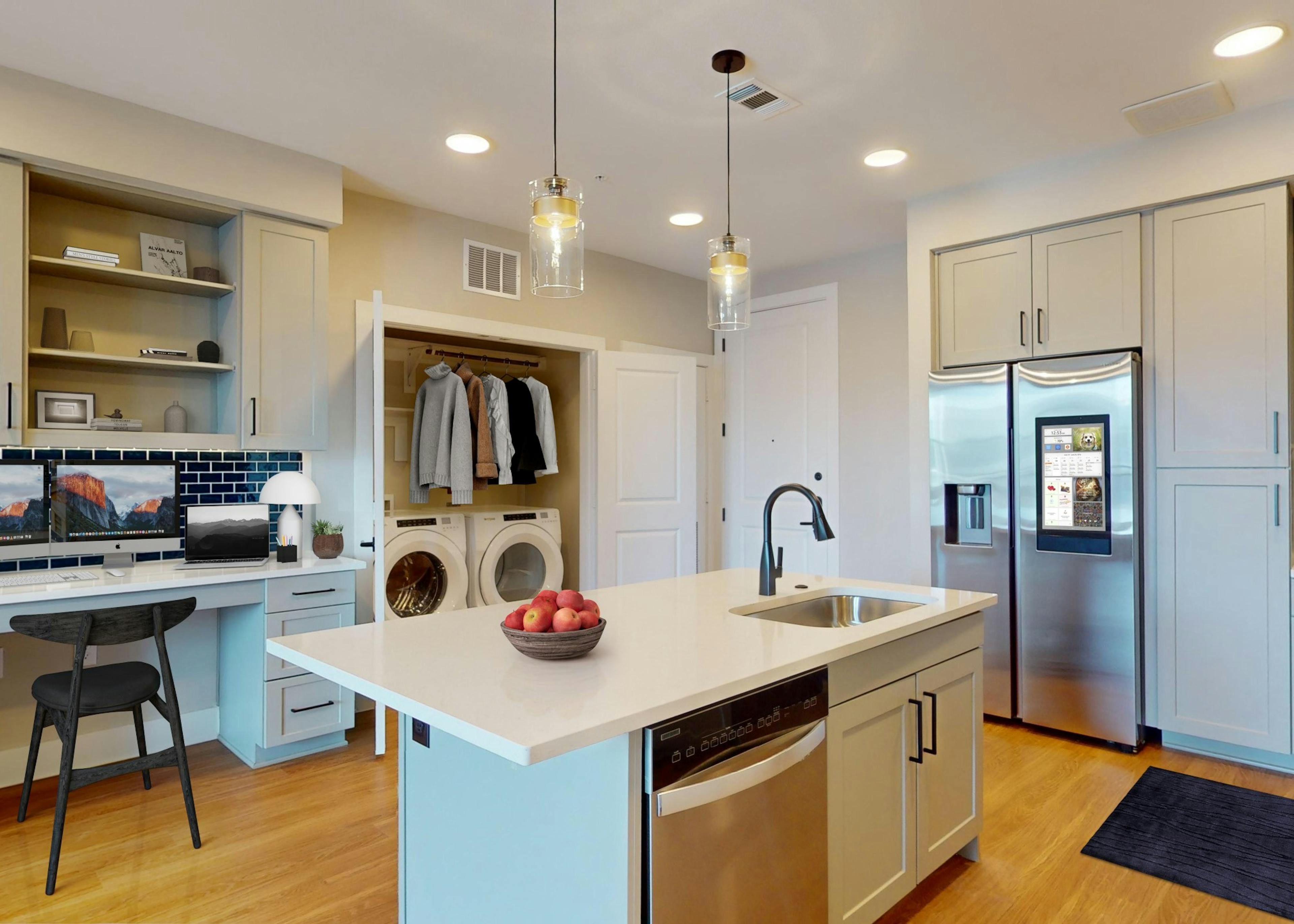 AMLI North Park kitchen with a built in desk, gray cabinets and stainless steel appliances including a smart refrigerator

 