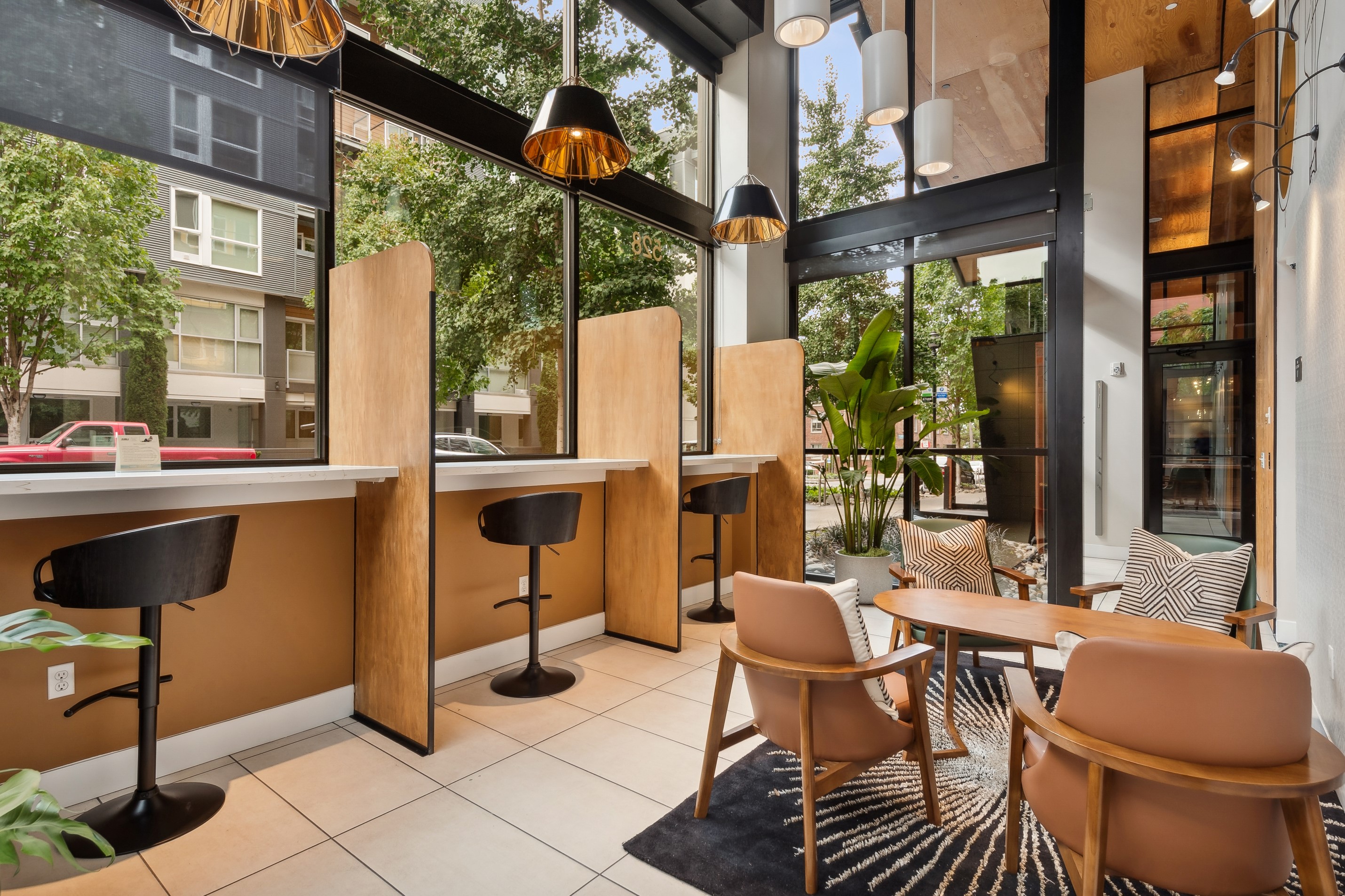 AMLI South Lake Union apartments residential coworking space with extra tall ceilings and windows that face the ground level of the street.