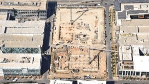 Aerial view of AMLI Park Central construction site with cranes and trucks and the east garage retaining walls being poured