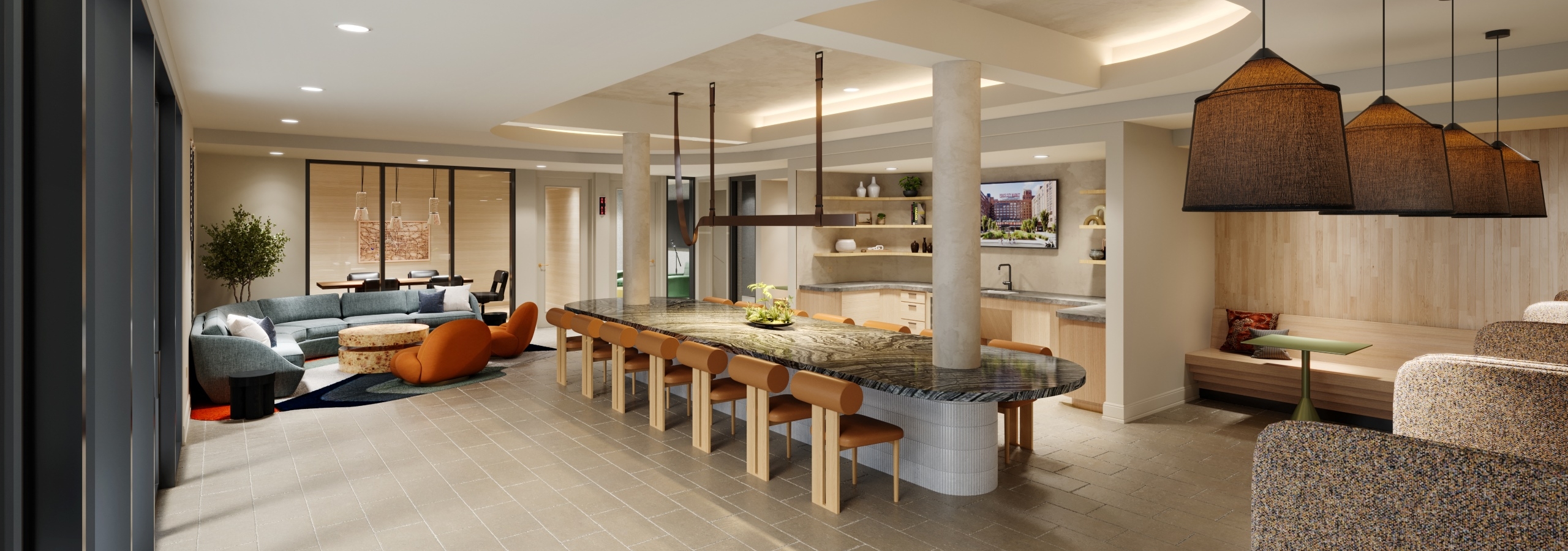 Resident lounge with large marble island at AMLI Old 4th Ward with various seating areas on tile floors and a kitchen.