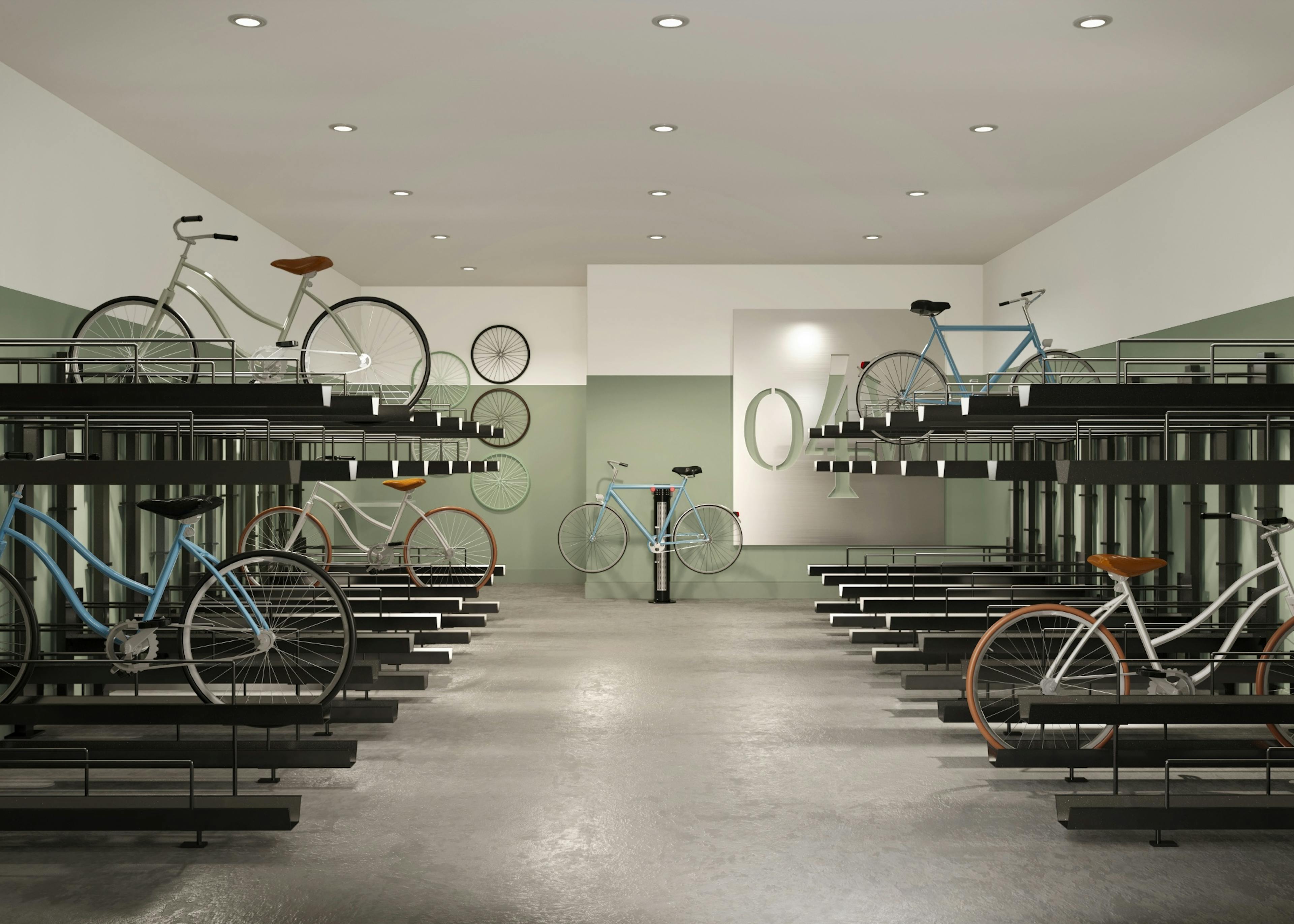 Rendering of AMLI Old 4th Ward bike room with two levels of metal bike racks, green and white walls, a concrete floor and a metal sign.