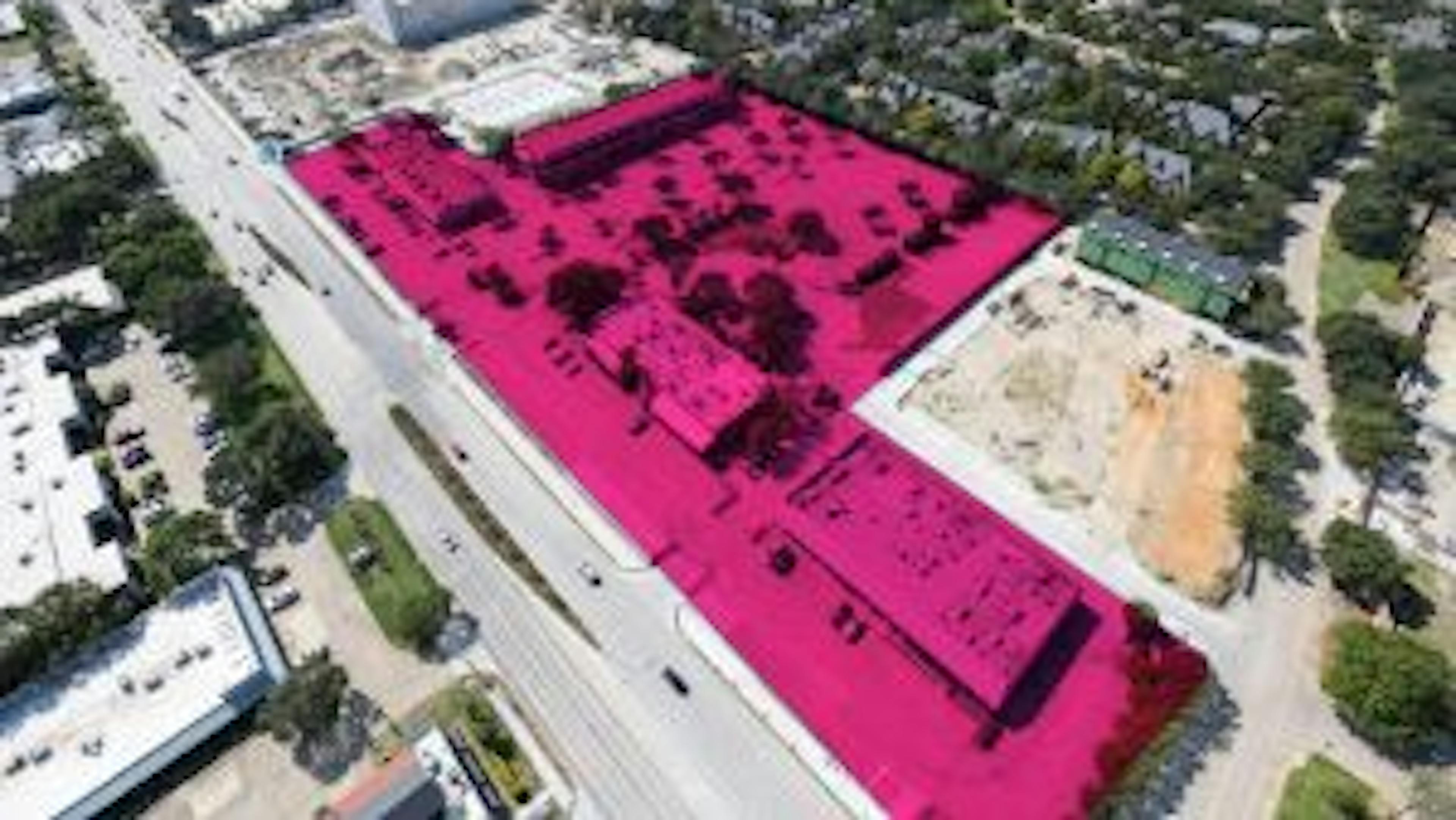 Aerial view of AMLI Treehouse construction site with land owned shaded in bright pink 