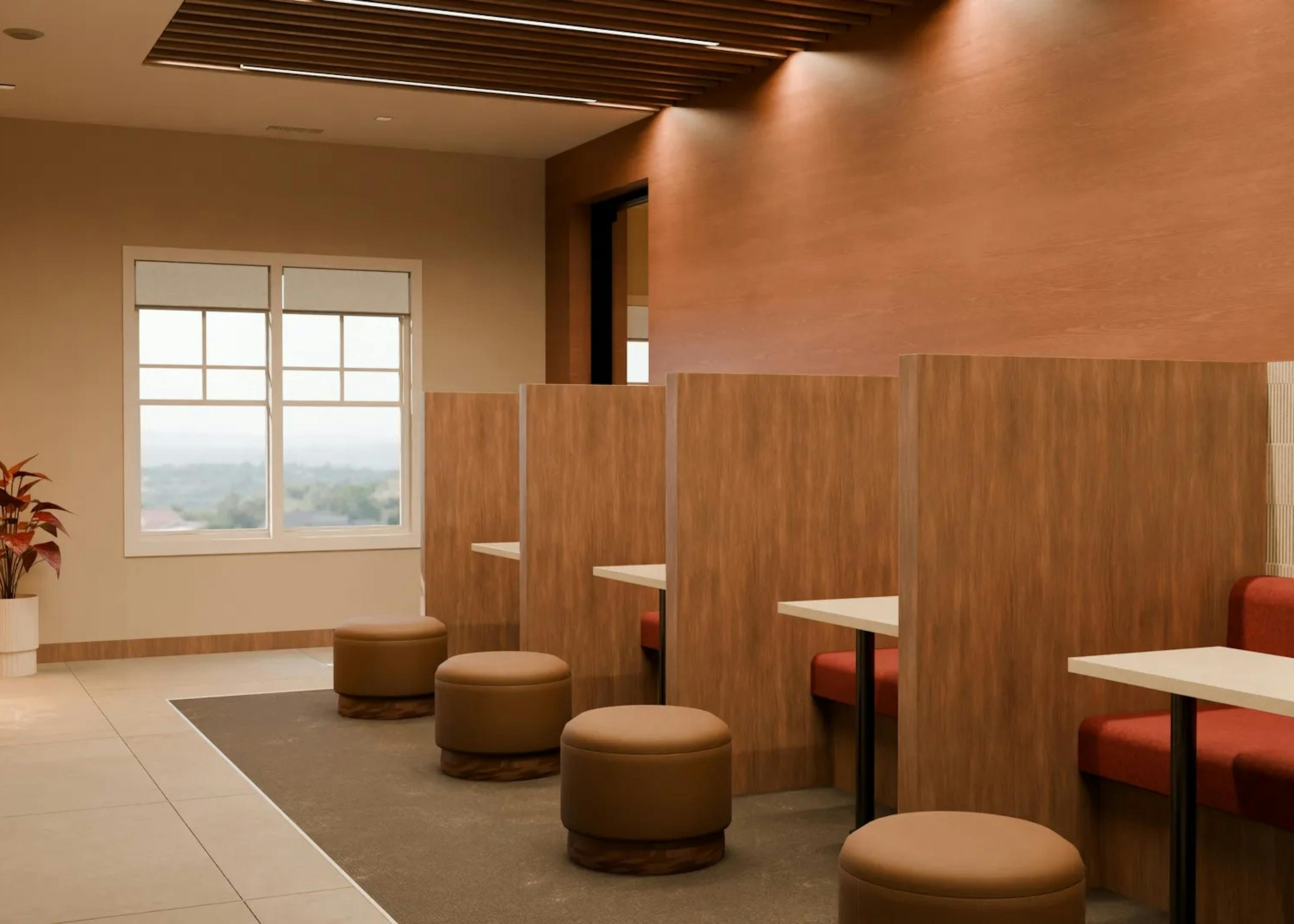 Rendering of coworking space at AMLI Brookhaven apartments with red booths and wood tables with round leather stools and wood dividers
