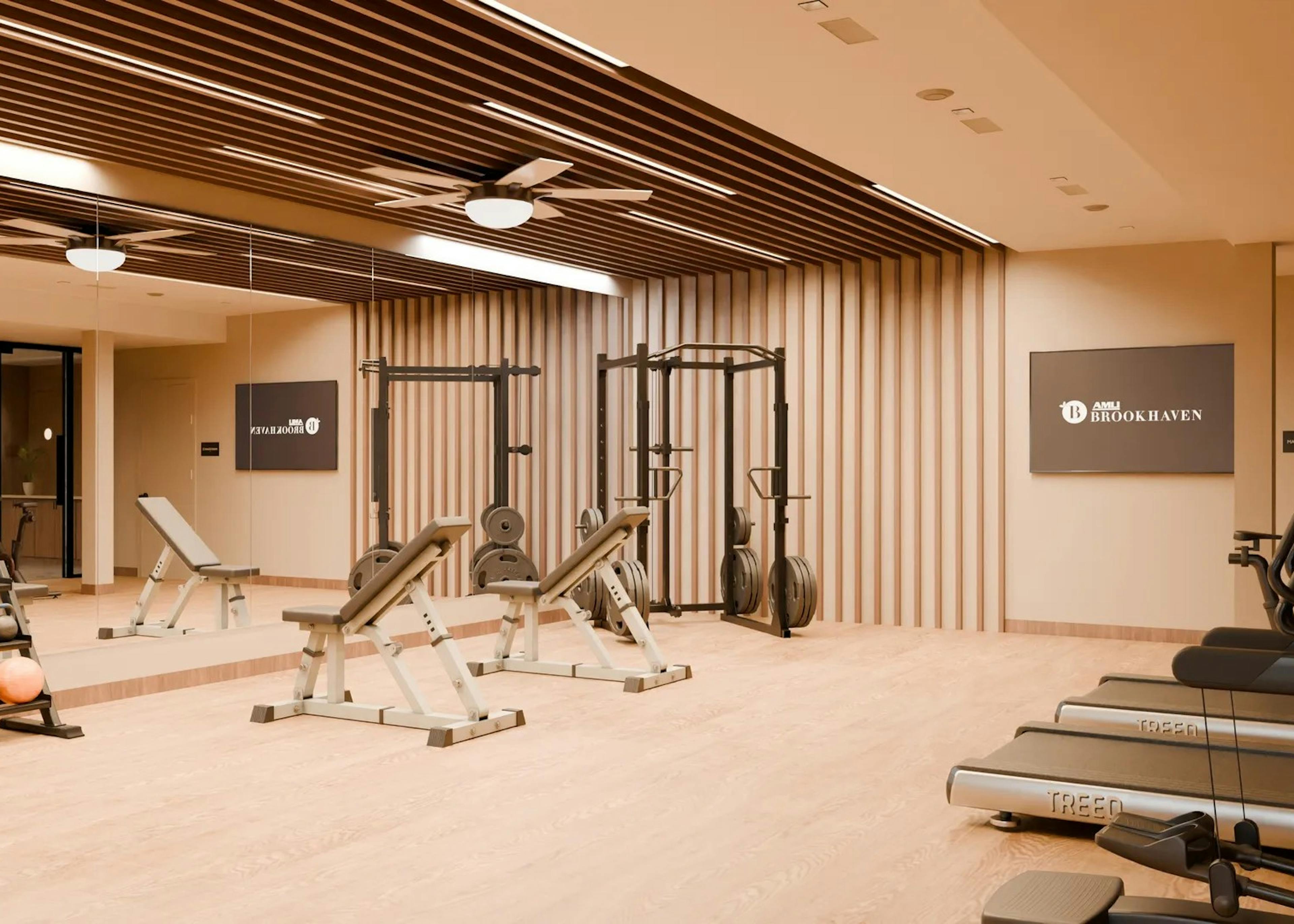 Rendering for AMLI Brookhaven fitness center with various weights and machines set on a wood floor against a mirrored wall
