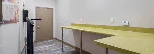 AMLI Old 4th Ward bike repair room with large table set up for all bike repair needs and air pump for bike tires
