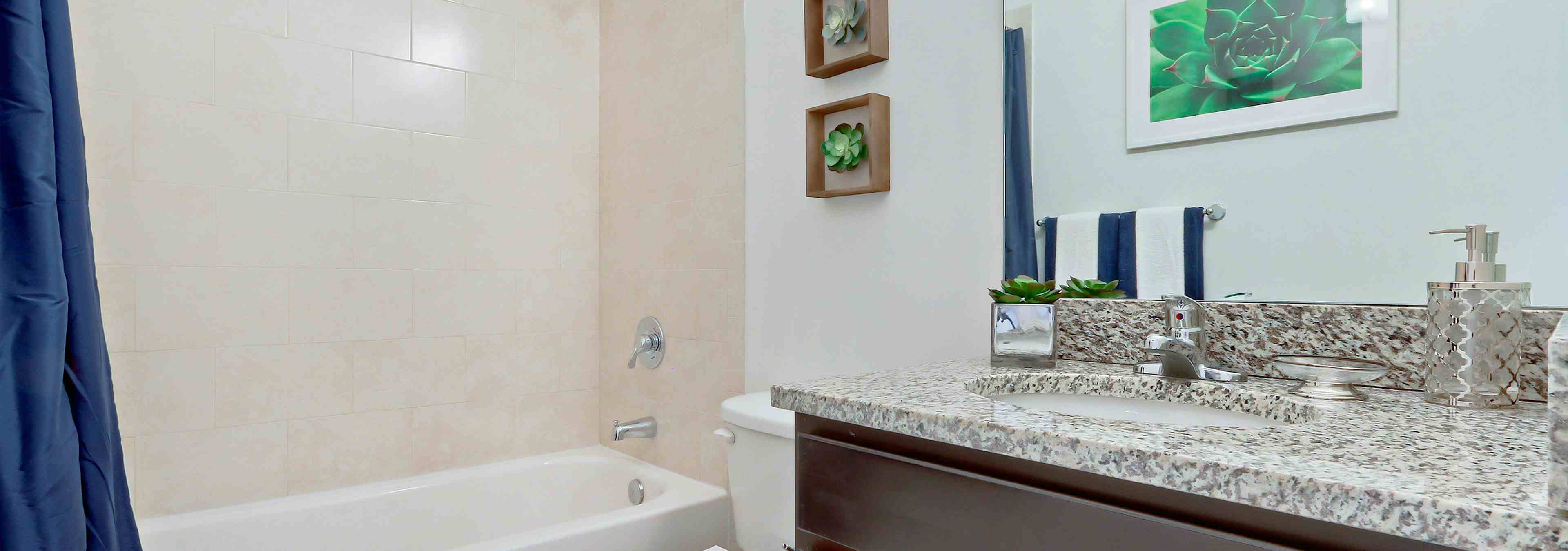 Interior view of AMLI Toscana Place townhome bathroom with vanity, toilet and soaking tub