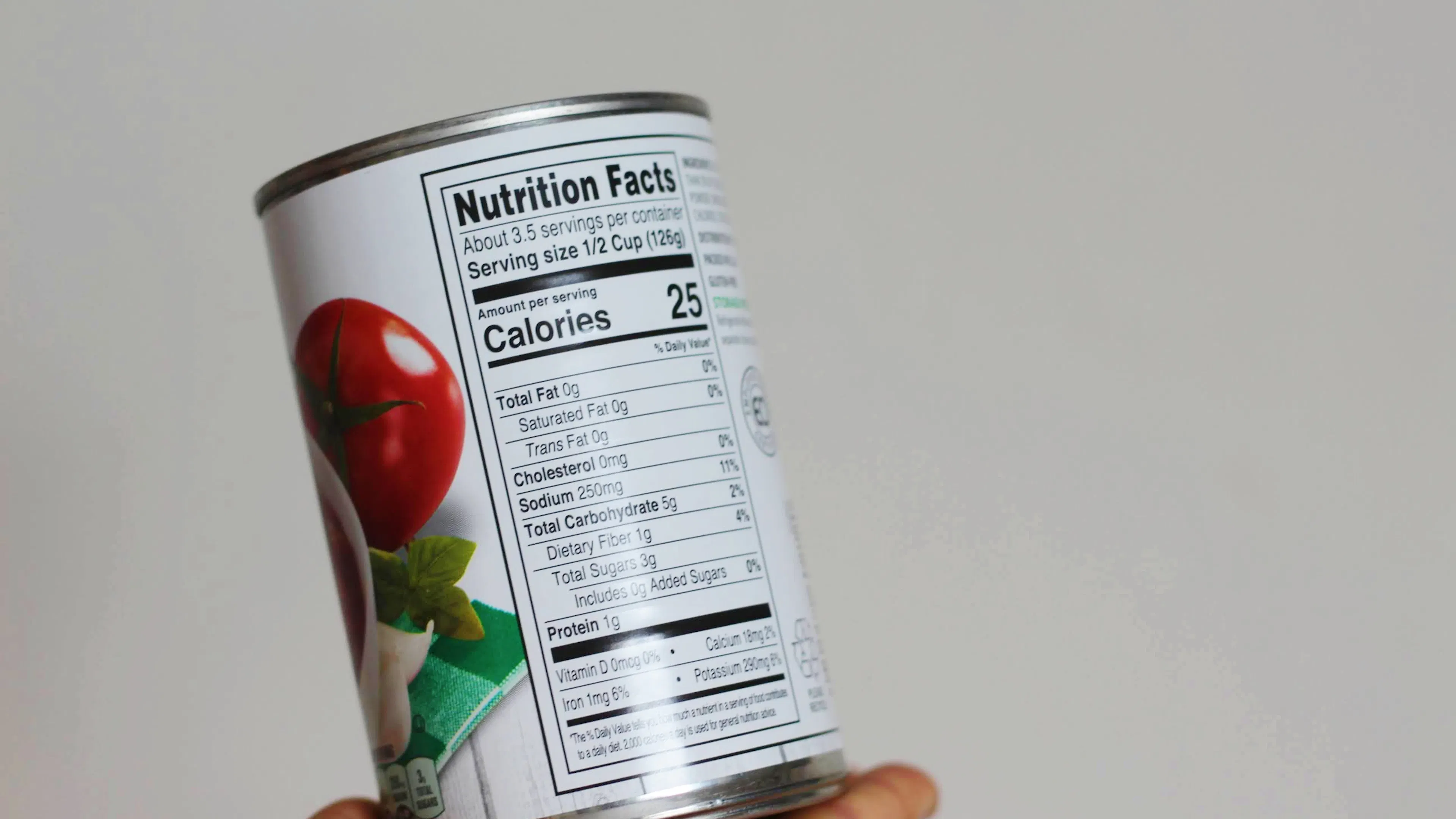 A simple can of diced tomatoes with the nutrition label facing out toward the viewer