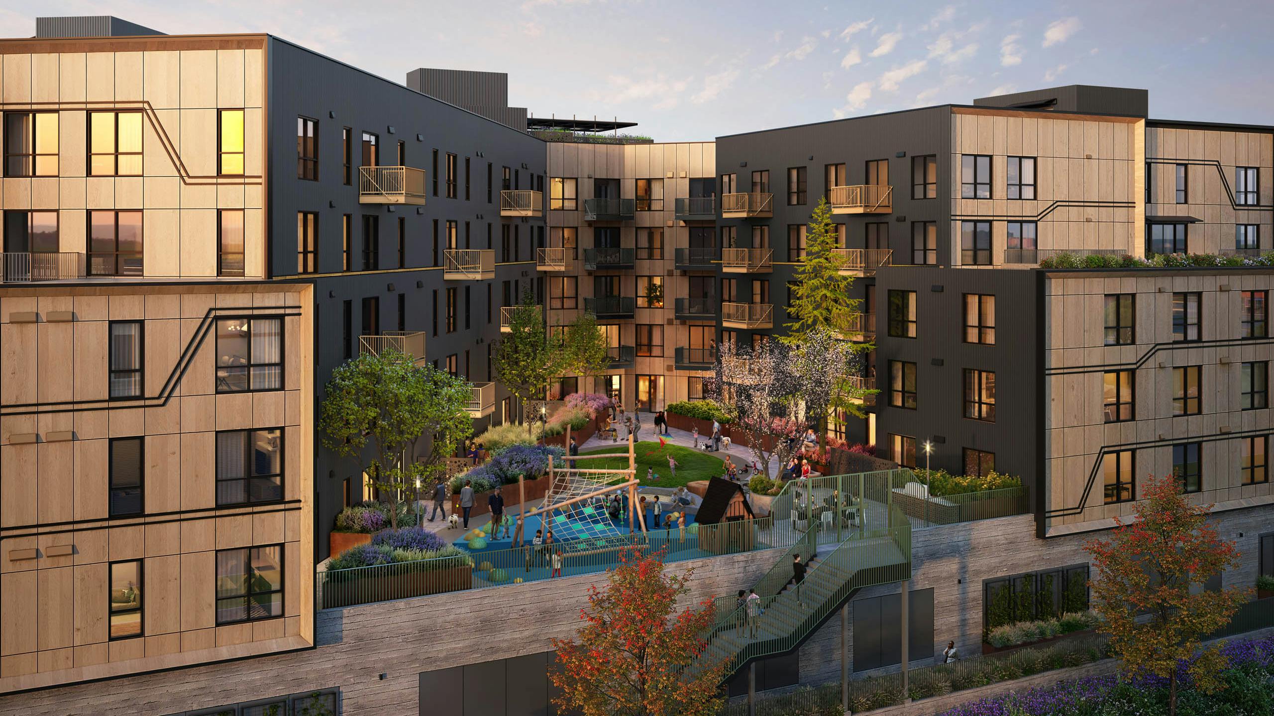 Modern residential building at AMLI Redmond Way apartments with landscaped courtyard and children's playground