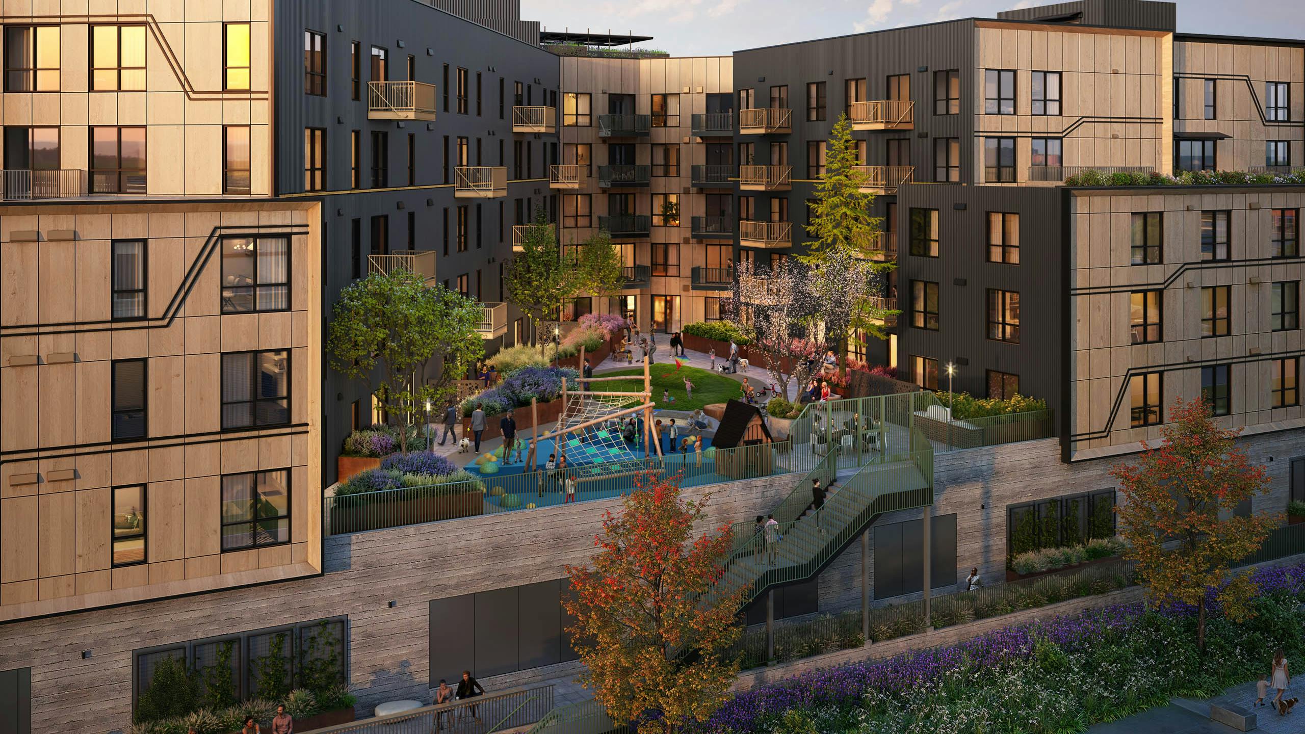 Modern residential building at AMLI Redmond Way apartments with landscaped courtyard and children's playground