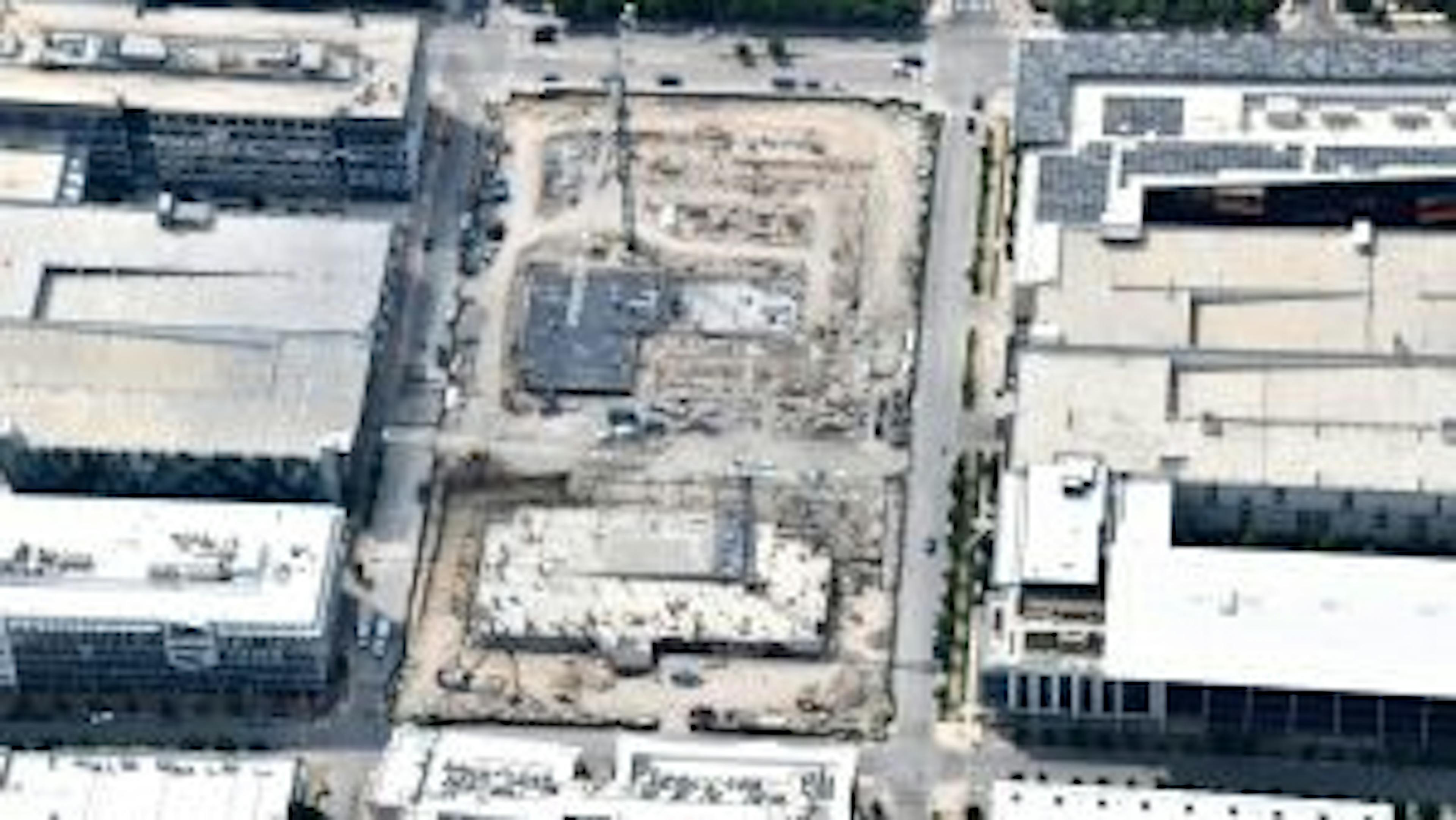 Aerial view of AMLI Park Central construction site with buildings having parking decks and columns poured