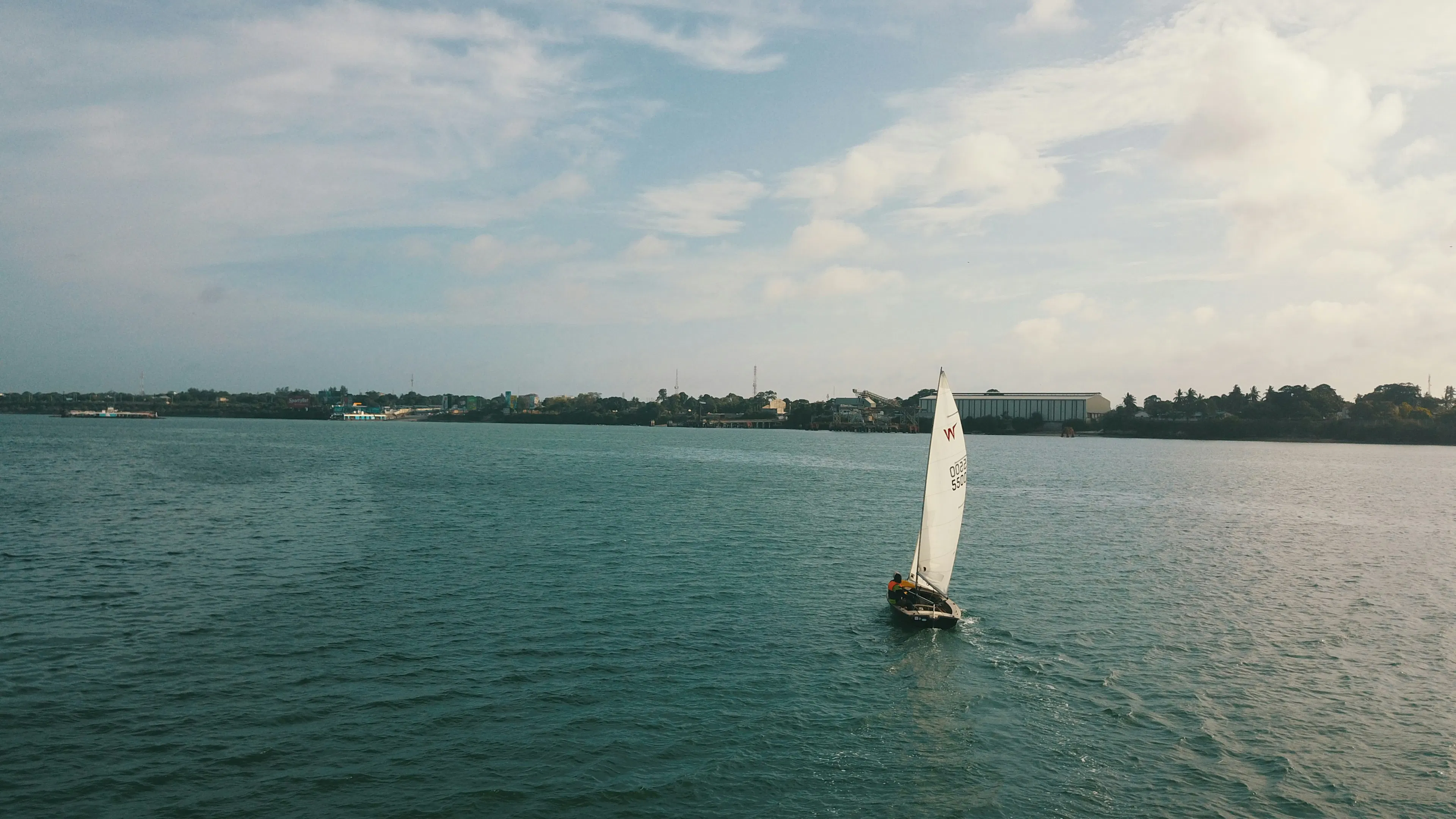 A sailboat cruising off the coast of Miami