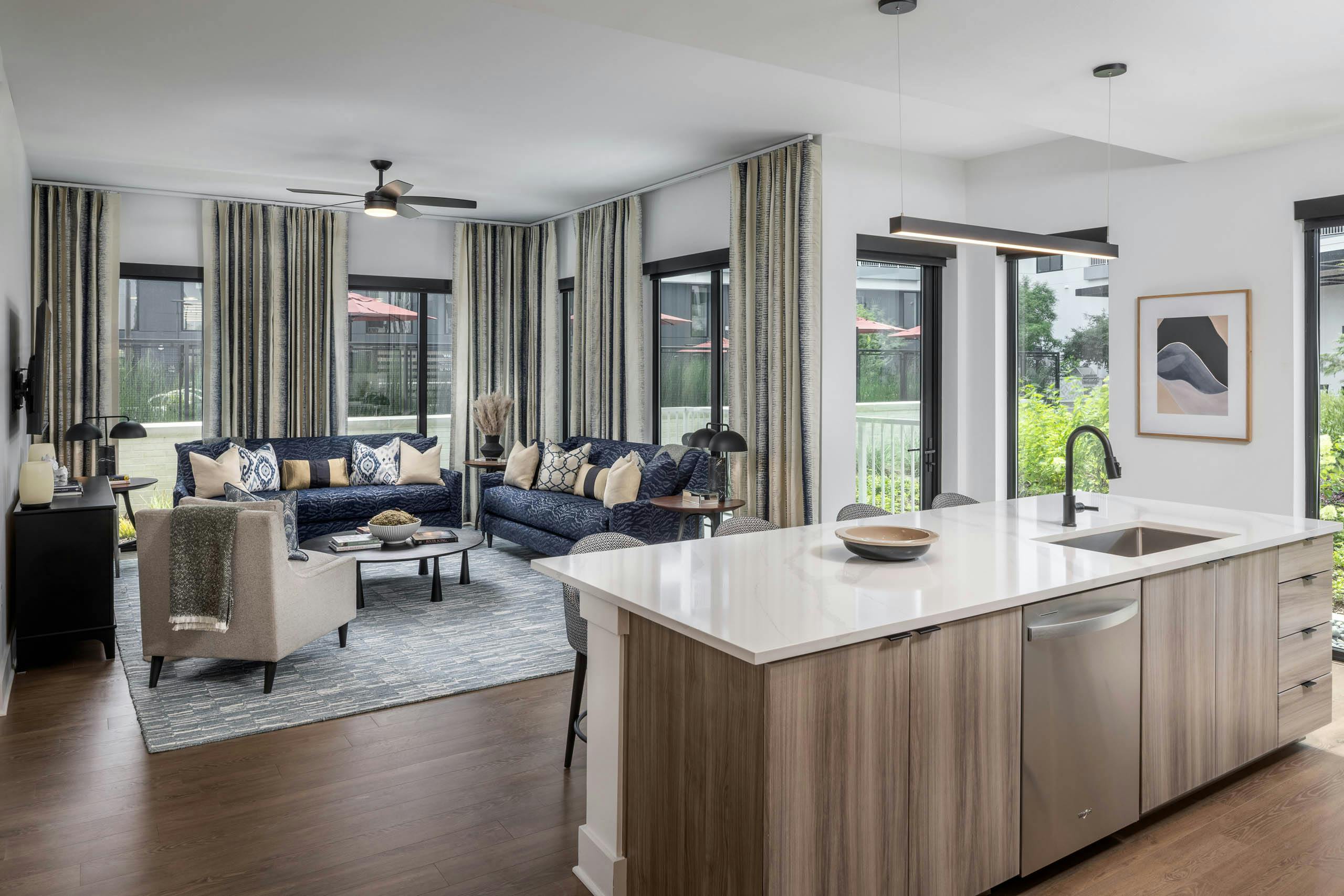 Living room and kitchen island of AMLI Atlantic Station’s model apartment.