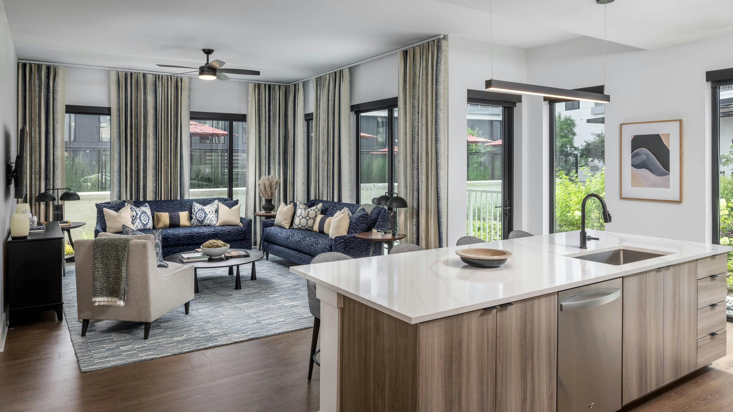 Living room and kitchen island of AMLI Atlantic Station’s model apartment.