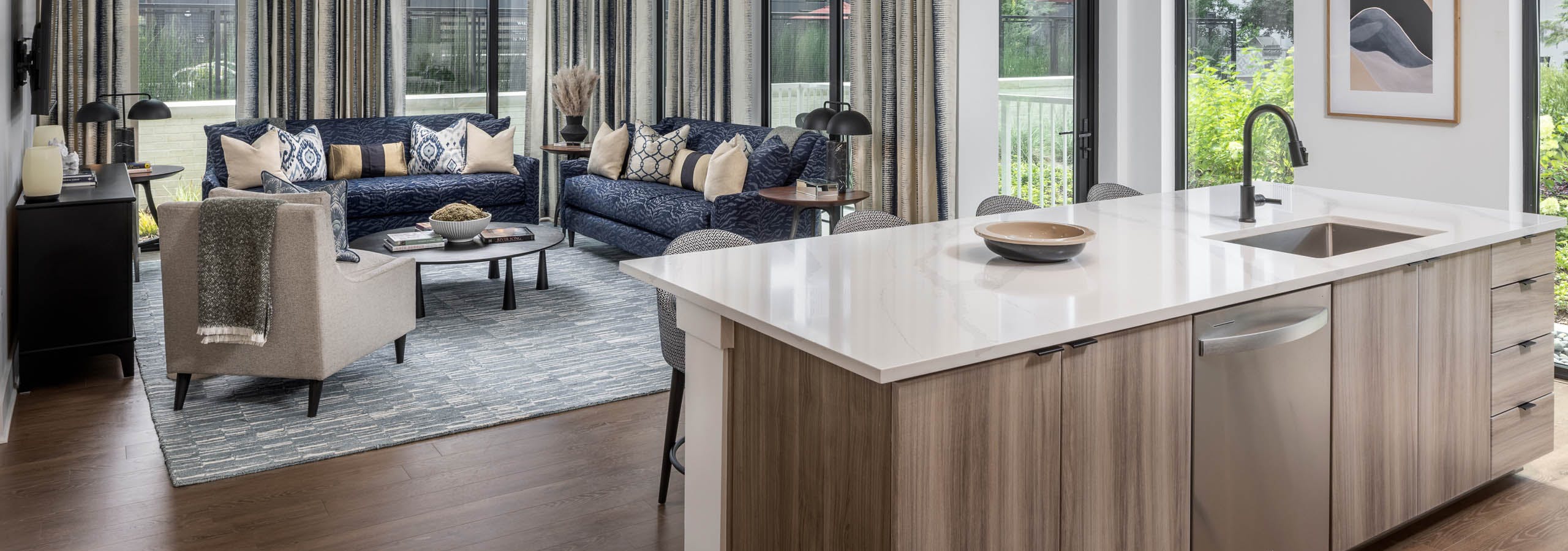 Living room and kitchen island of AMLI Atlantic Station’s model apartment.