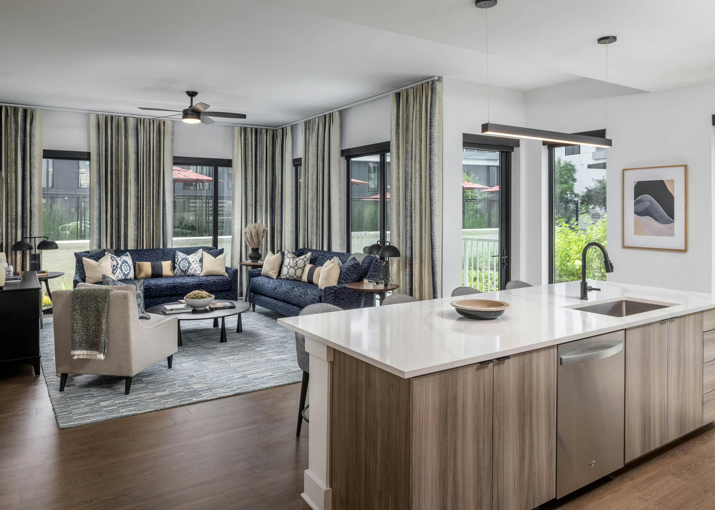 Living room and kitchen island of AMLI Atlantic Station’s model apartment.