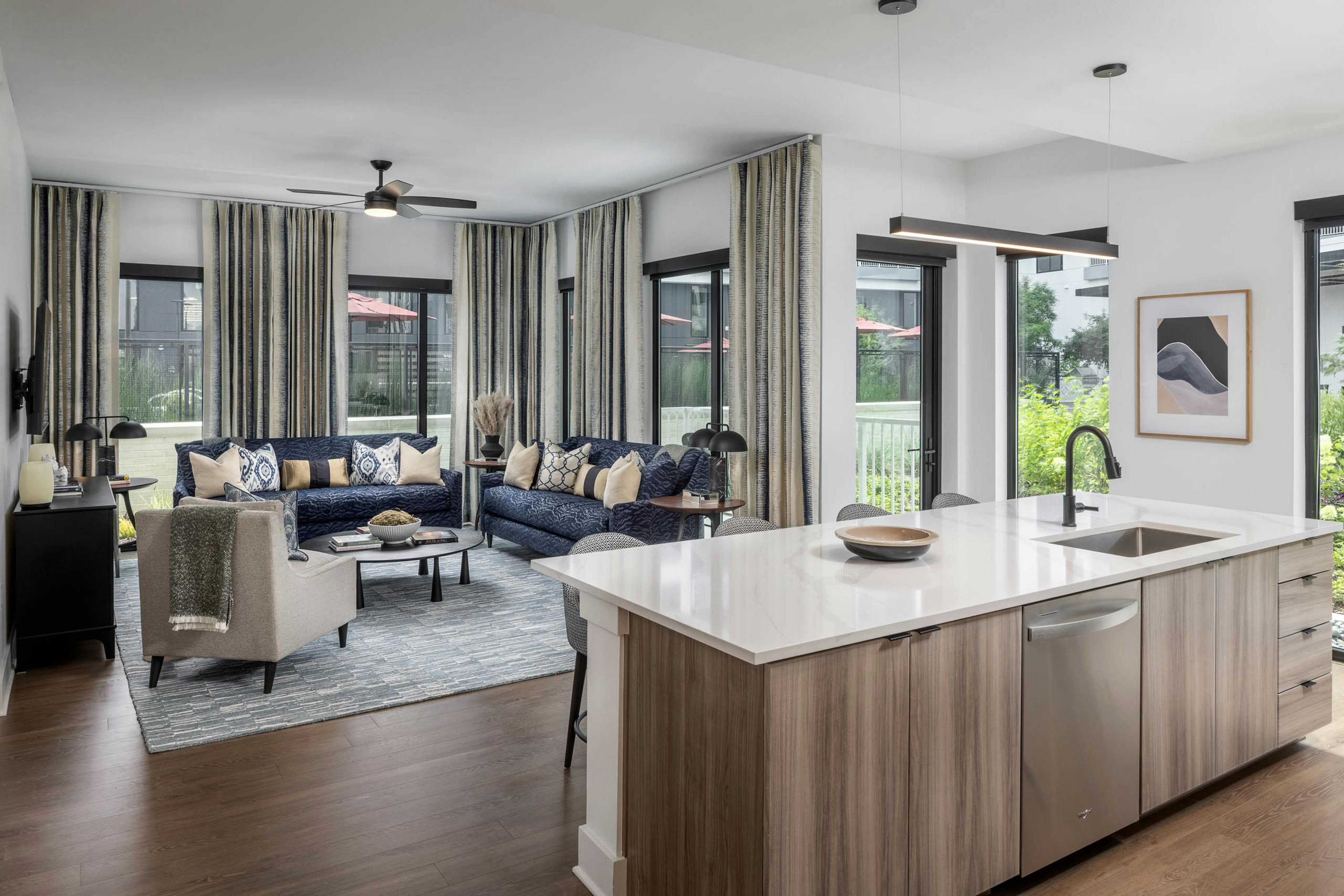 Living room and kitchen island of AMLI Atlantic Station’s model apartment.