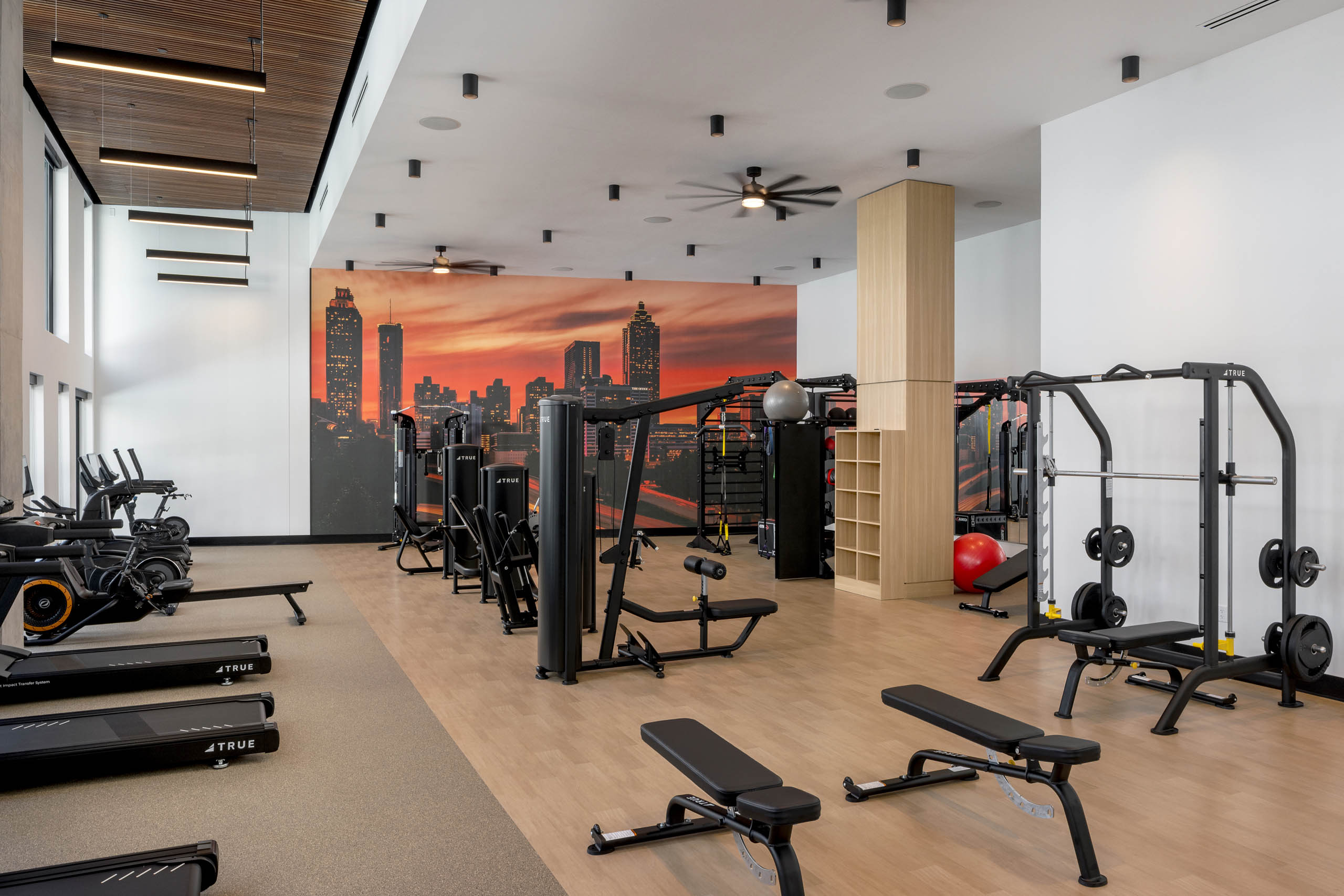 Fitness center at AMLI Atlantic Station with benches and equipment.