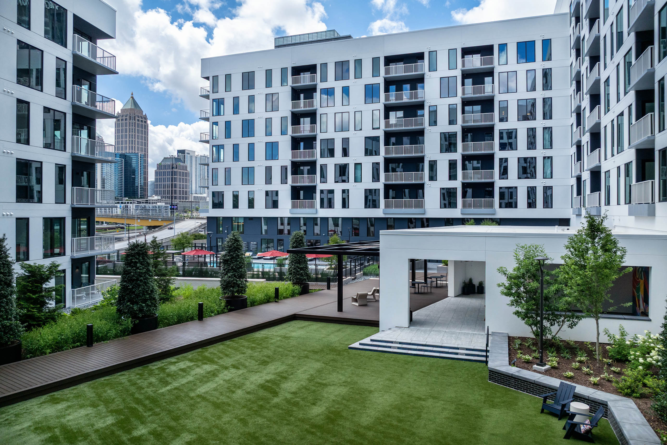 Greenspace in AMLI Atlantic Station courtyard with interior facing balconies.