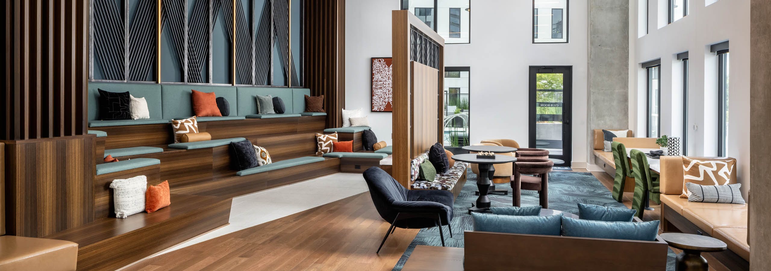 Raised seating and televisions in AMLI Atlantic Station’s clubroom.